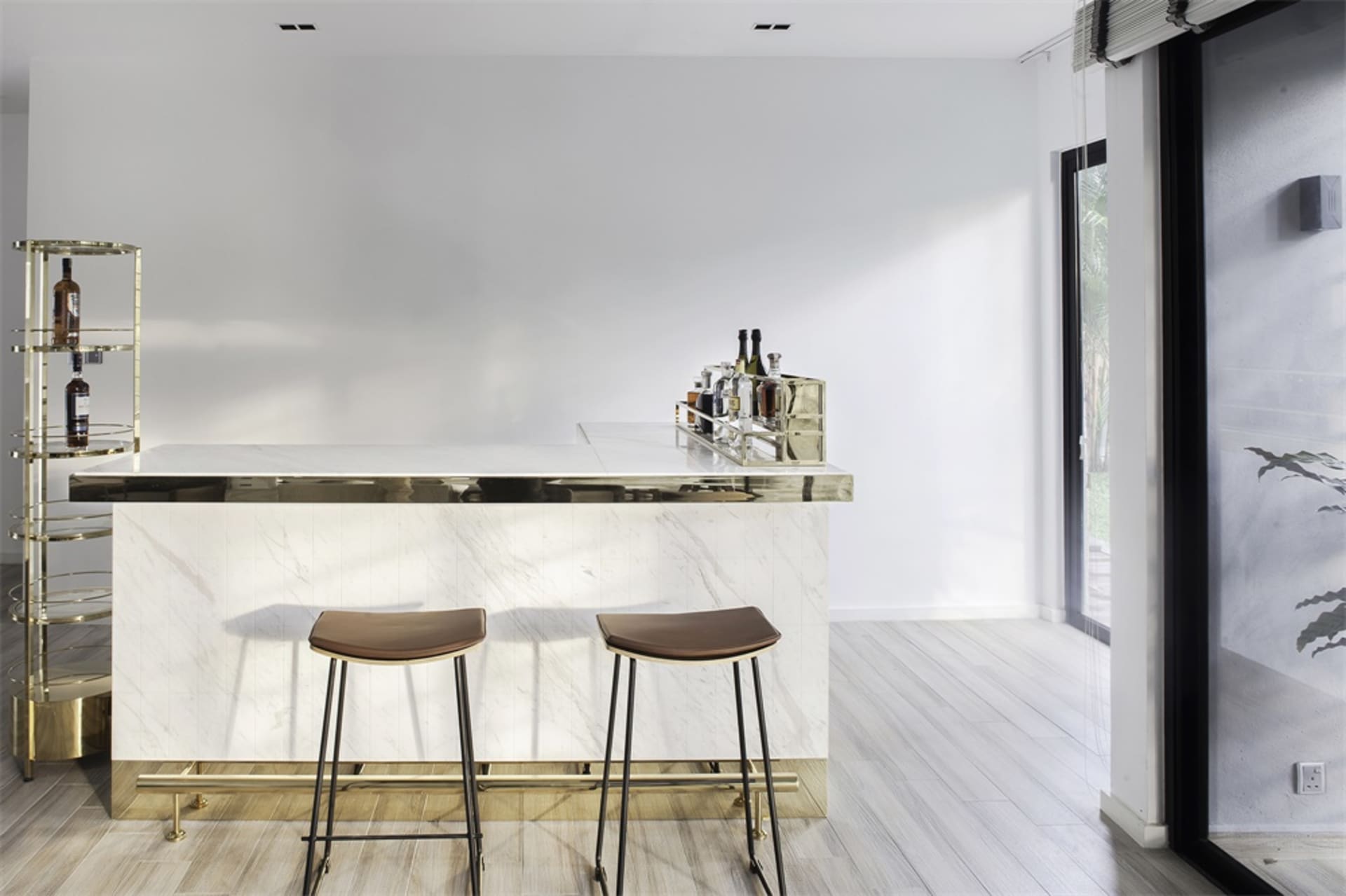 Minimalist design with white marble top and bar stools.