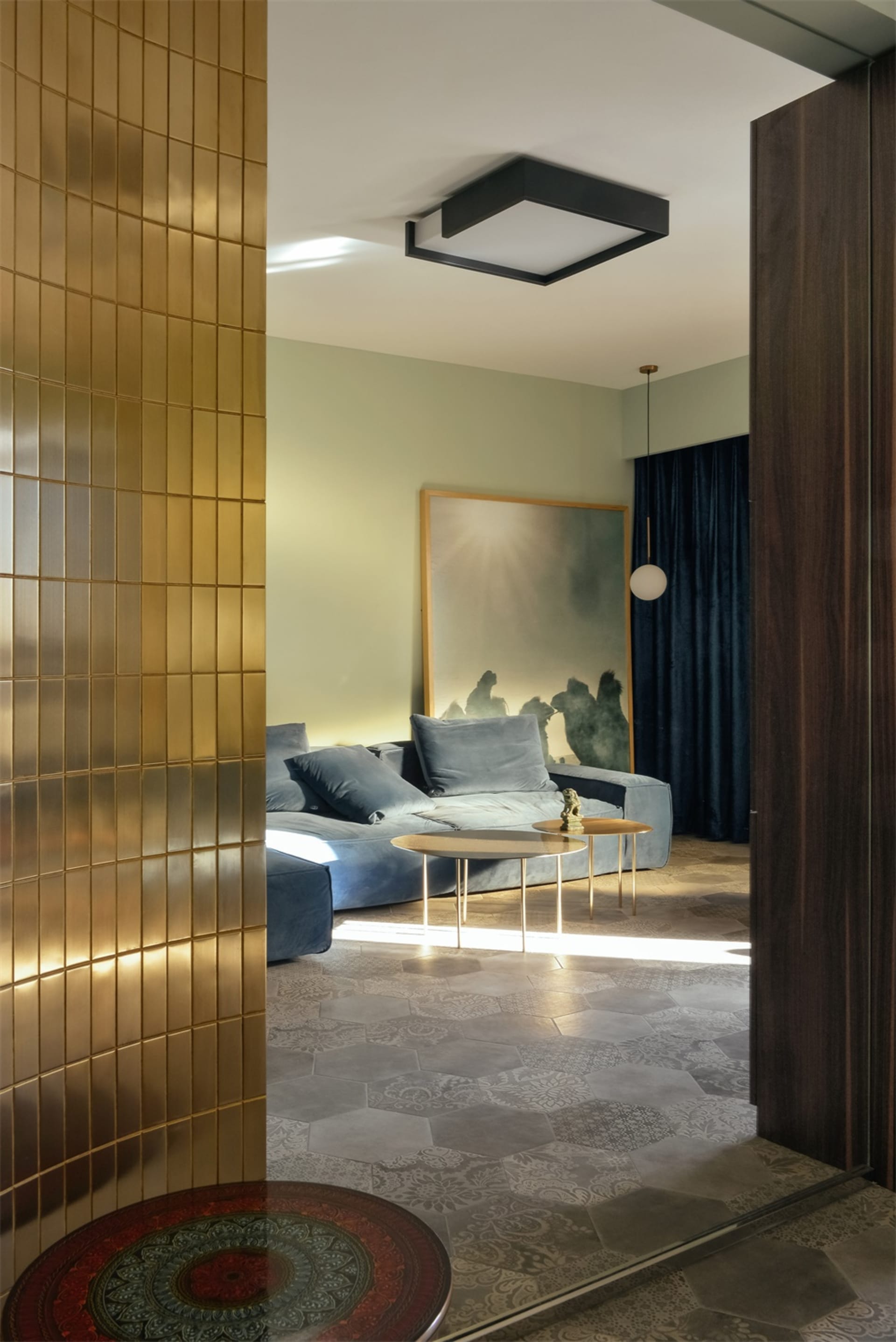Modern minimalist living room with metal tiles, glass, and cement