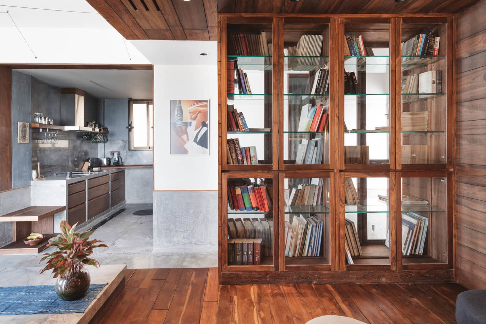 A modern residential interior featuring a living room with wooden elements.