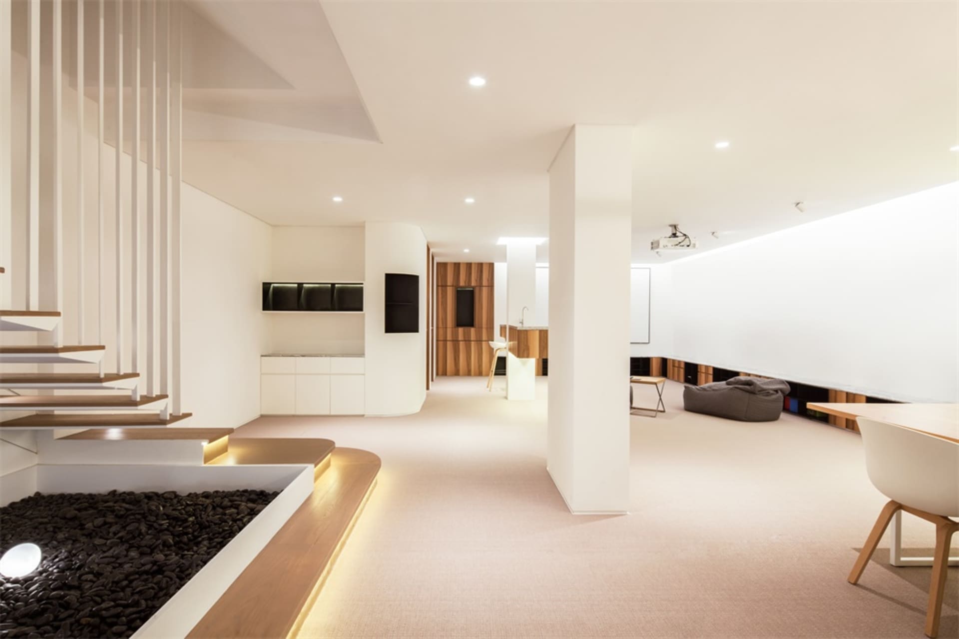 Modern residential interior with minimalist design, featuring natural wood flooring and clean lines.