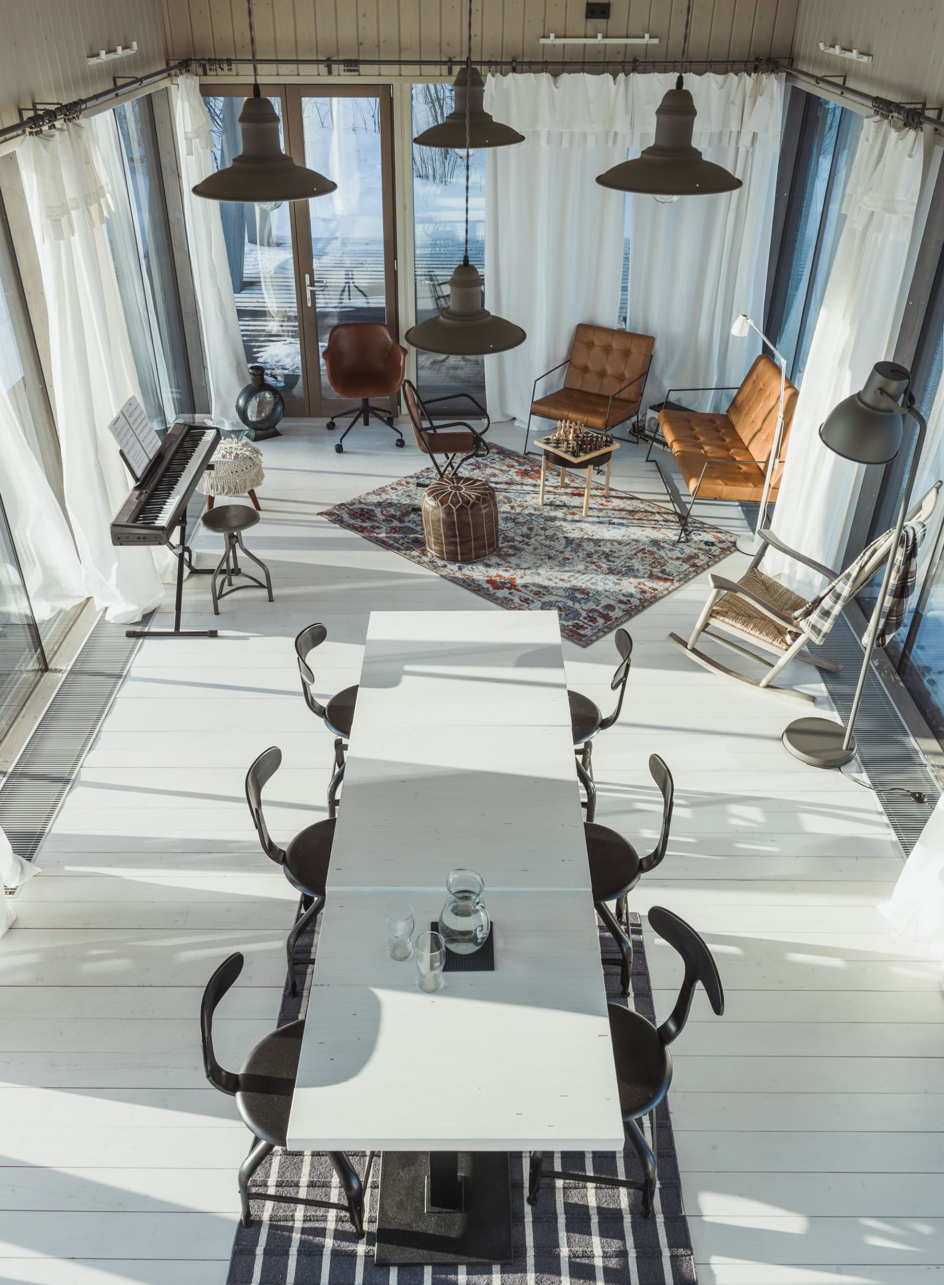 A modern industrial living room with marble flooring and mixed-media decorative accents.