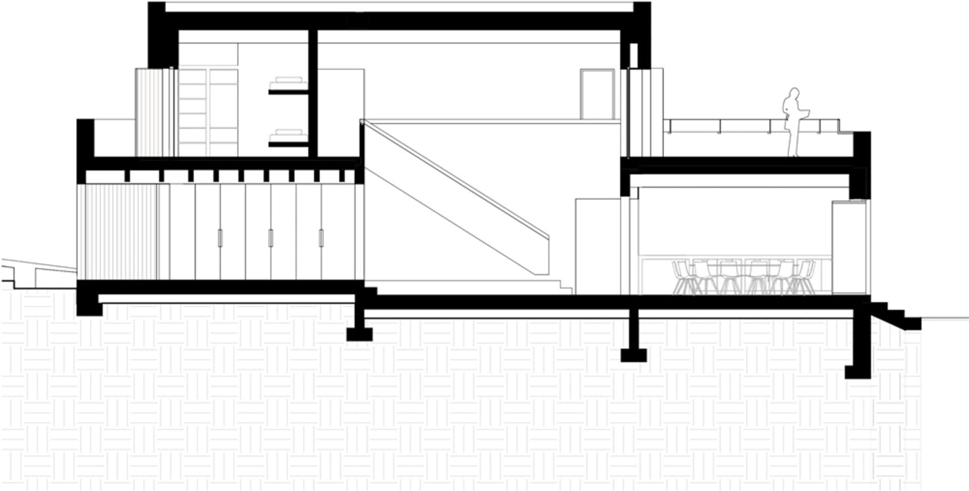 單色細緻建築平面圖,展示一棟兩層住宅建築,樓梯通往上層