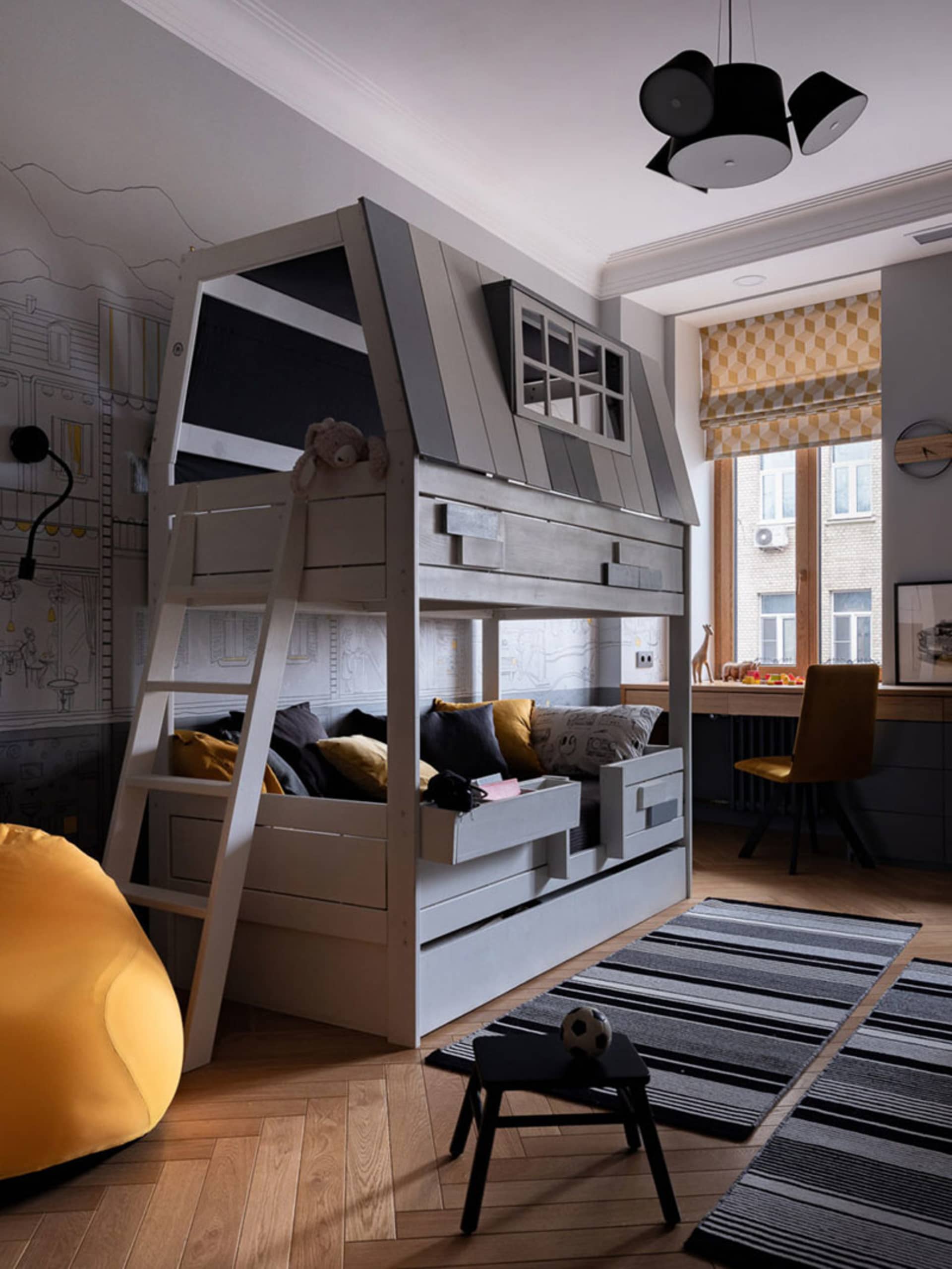 Modern children's bedroom featuring a bunk bed with a timber design, brightly colored textiles, and a yellow bean bag chair.