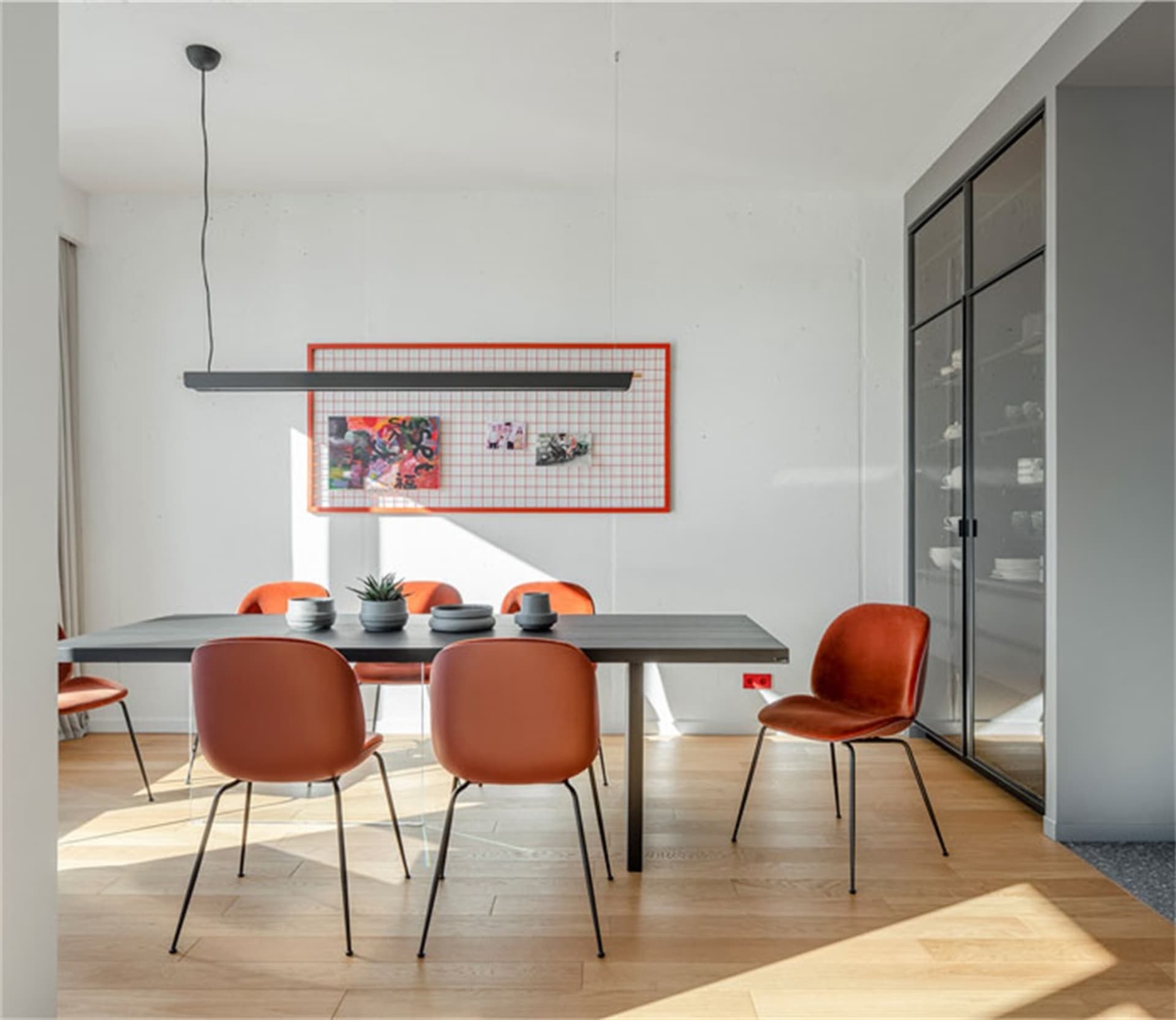 Minimalist dining room with a modern table and chairs
