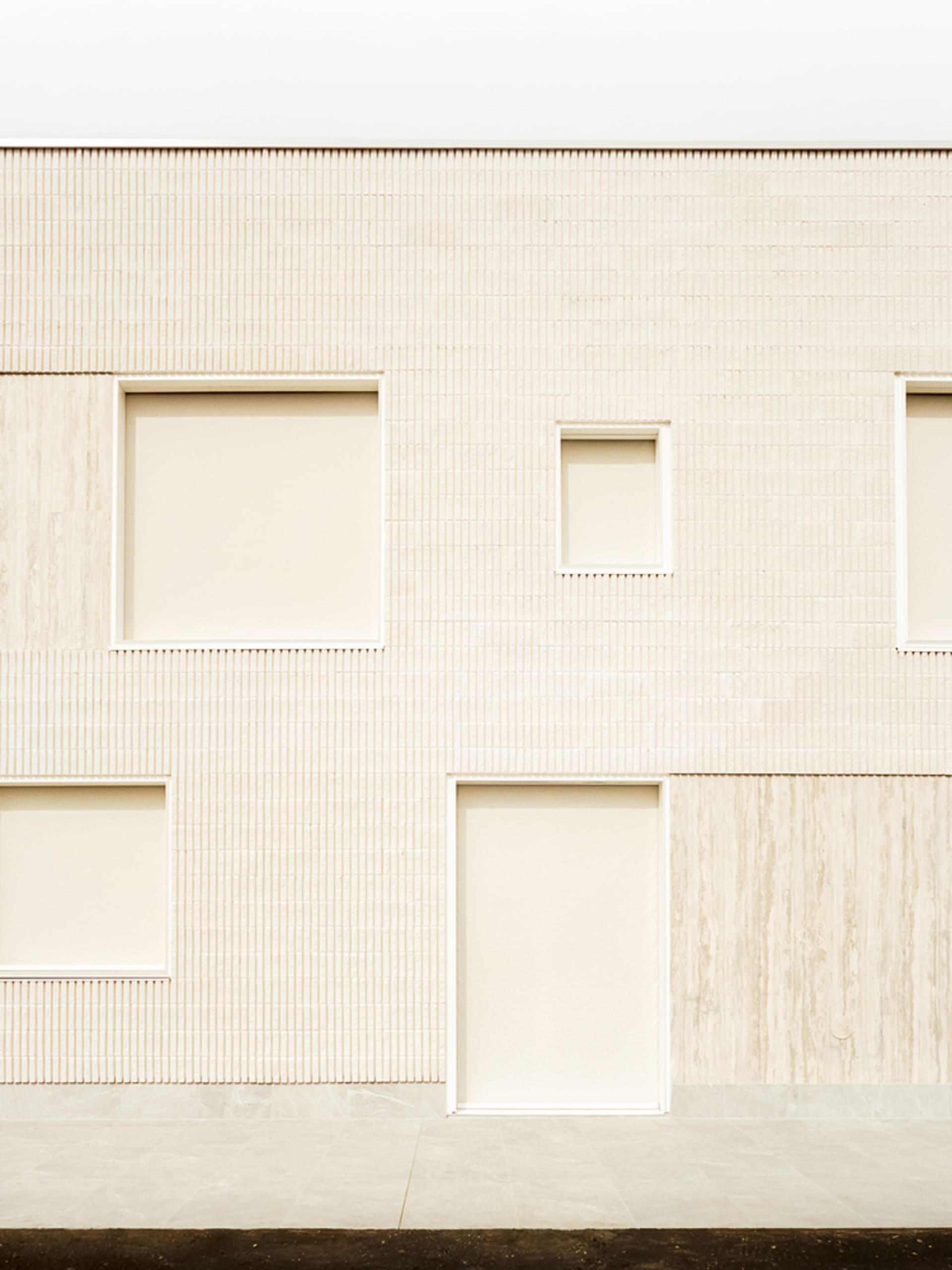 Modern building exterior with concrete facade and minimalistic design