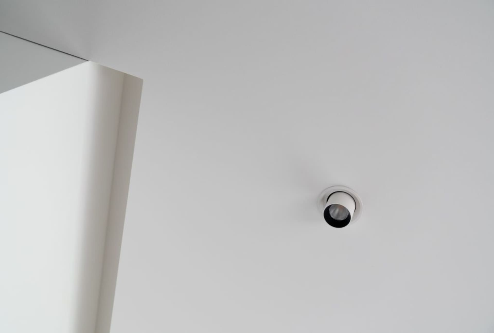 White ceiling with minimalist lighting fixture