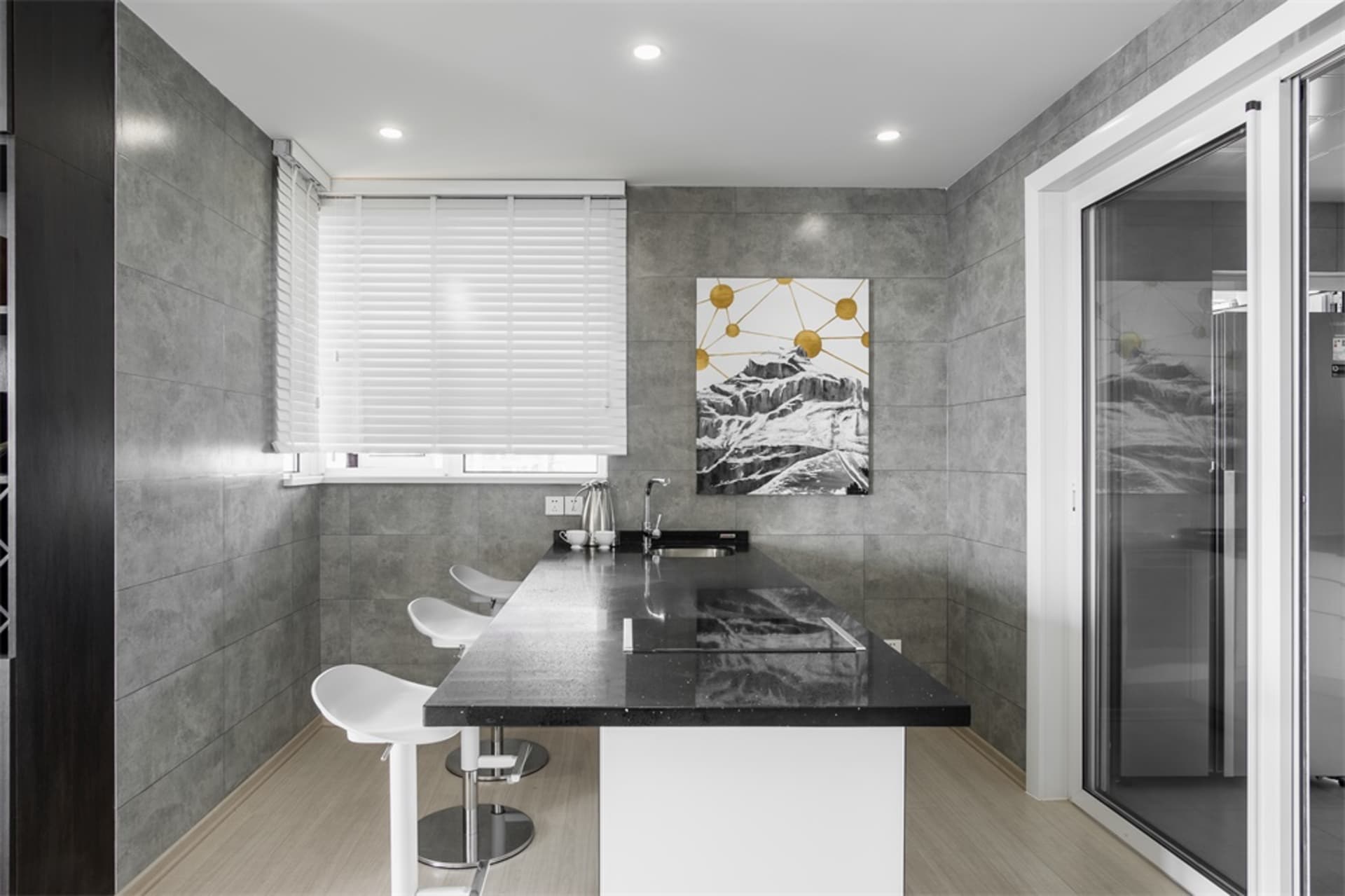 Minimalist kitchen featuring concrete countertops and minimalist design.