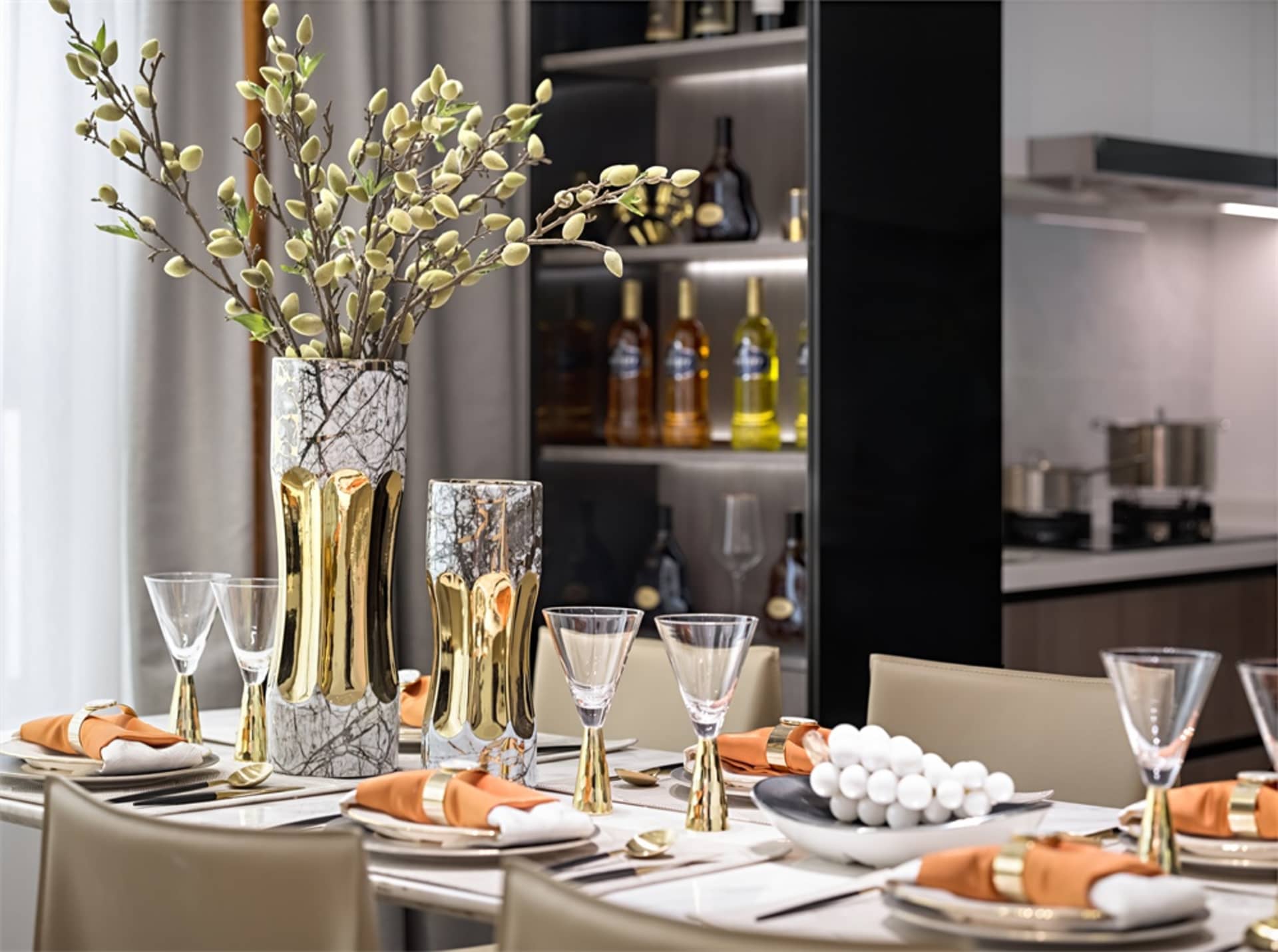 A modern dining room featuring marble and glass elements.