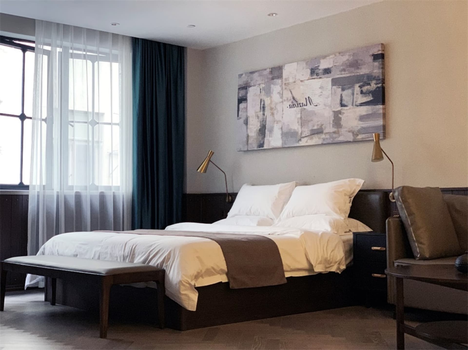 A modern bedroom with a brown bed in a minimalist style