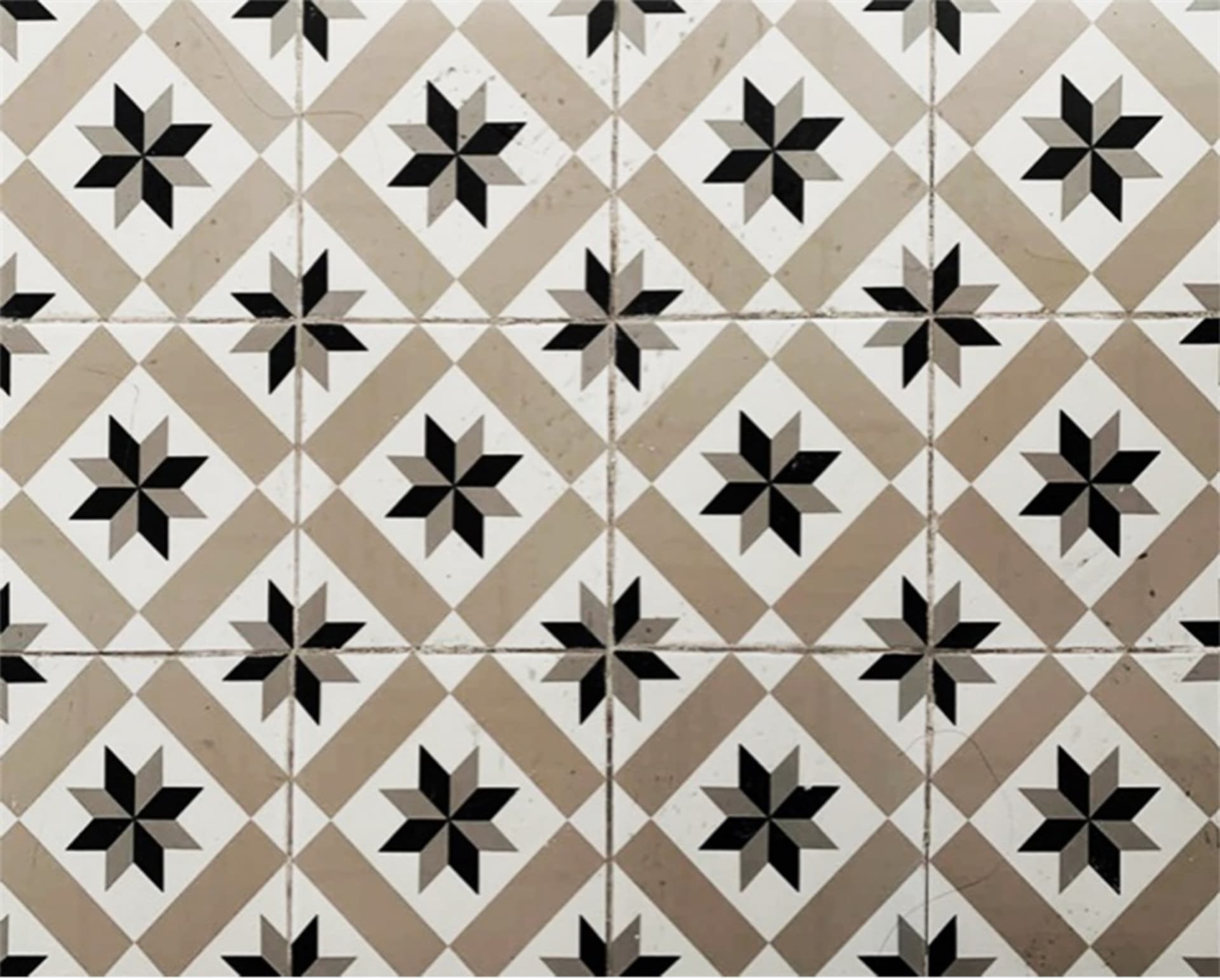 A modern interior design featuring a tile floor pattern with geometric shapes.