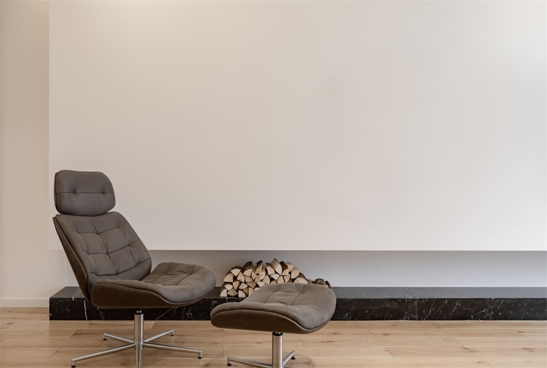 A modern interior design featuring a marble counter and wooden floor.