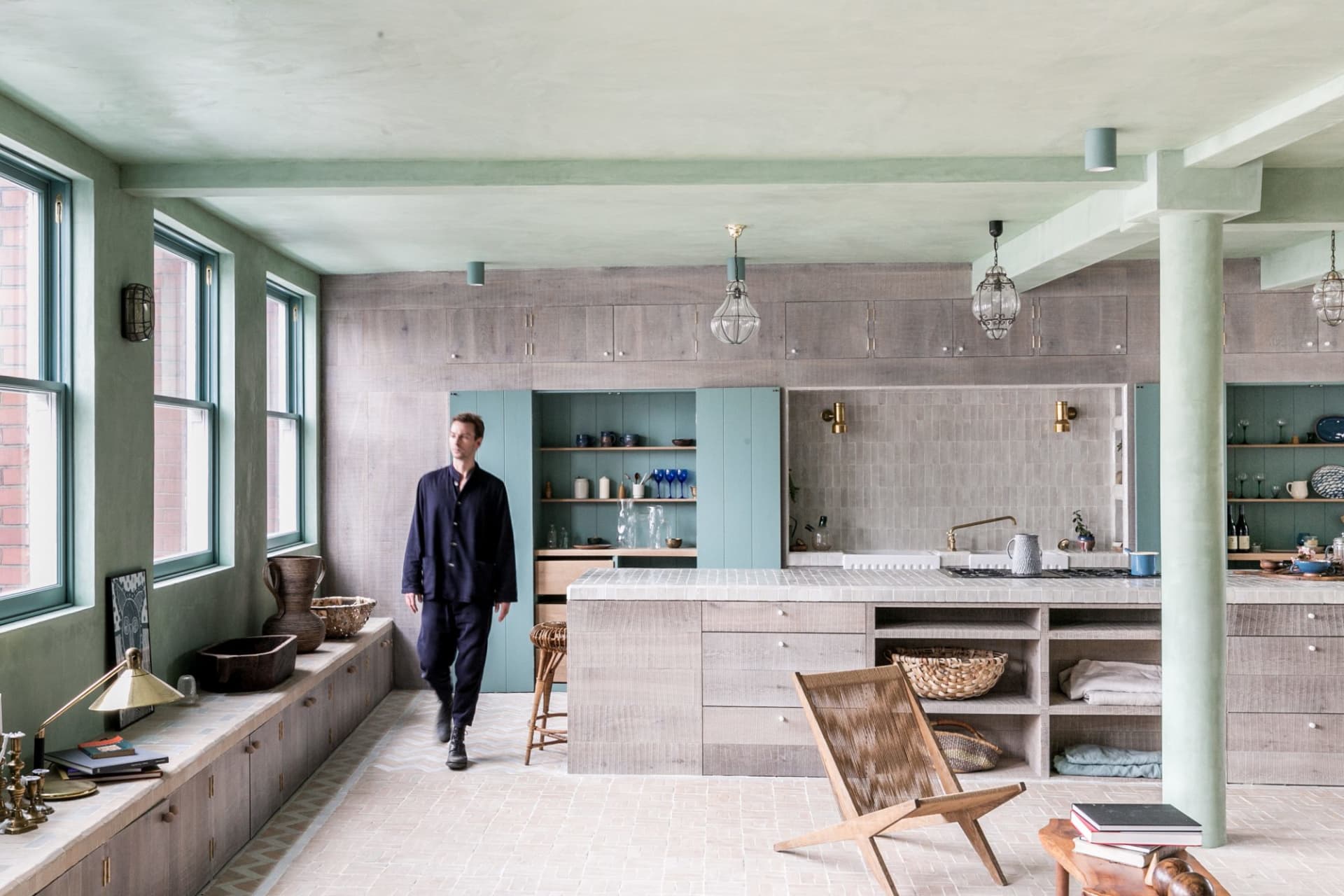 A modern kitchen with wooden cabinets and a large island.
