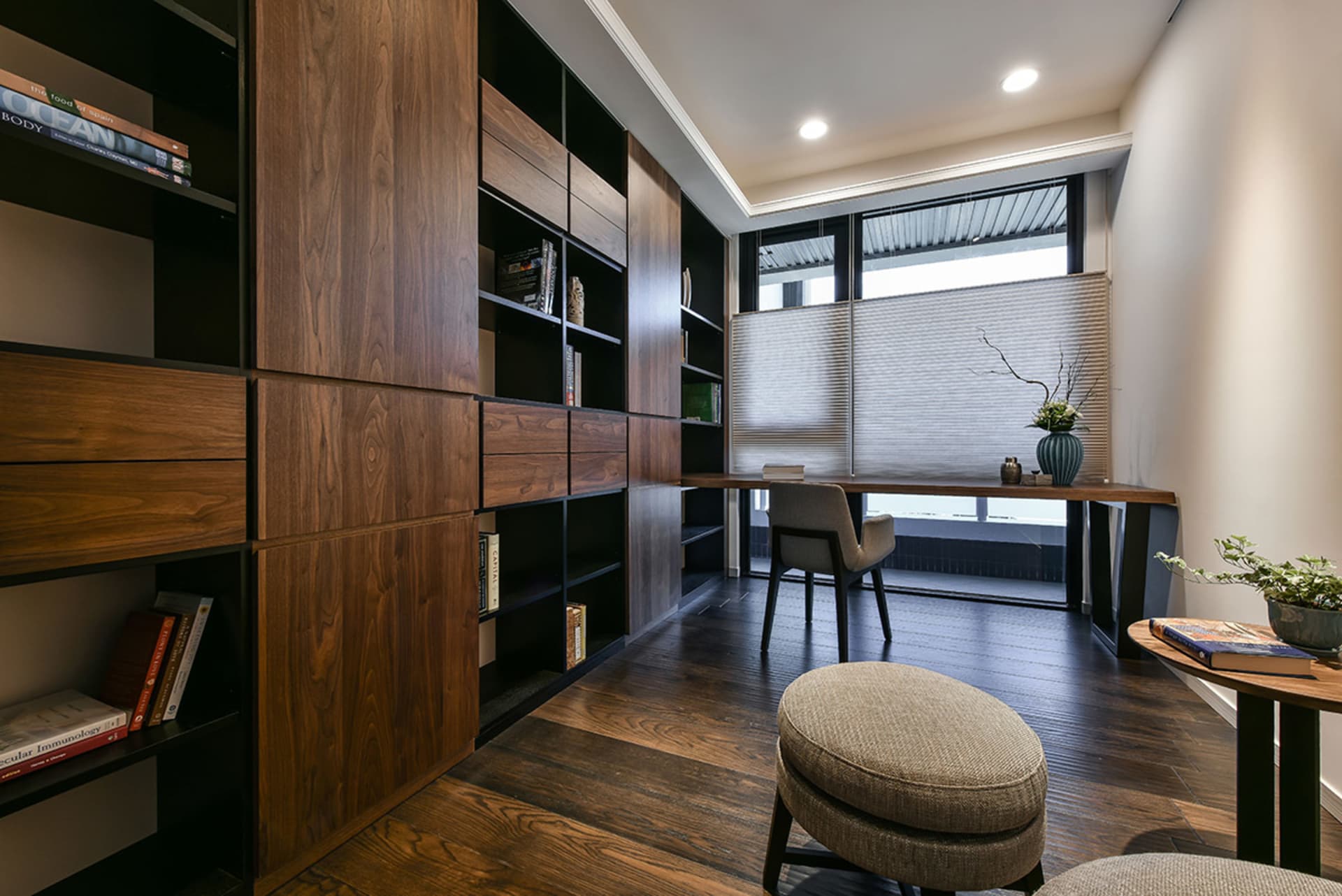 A modern contemporary home office with a wooden wall and floor, featuring a desk and chair setup.