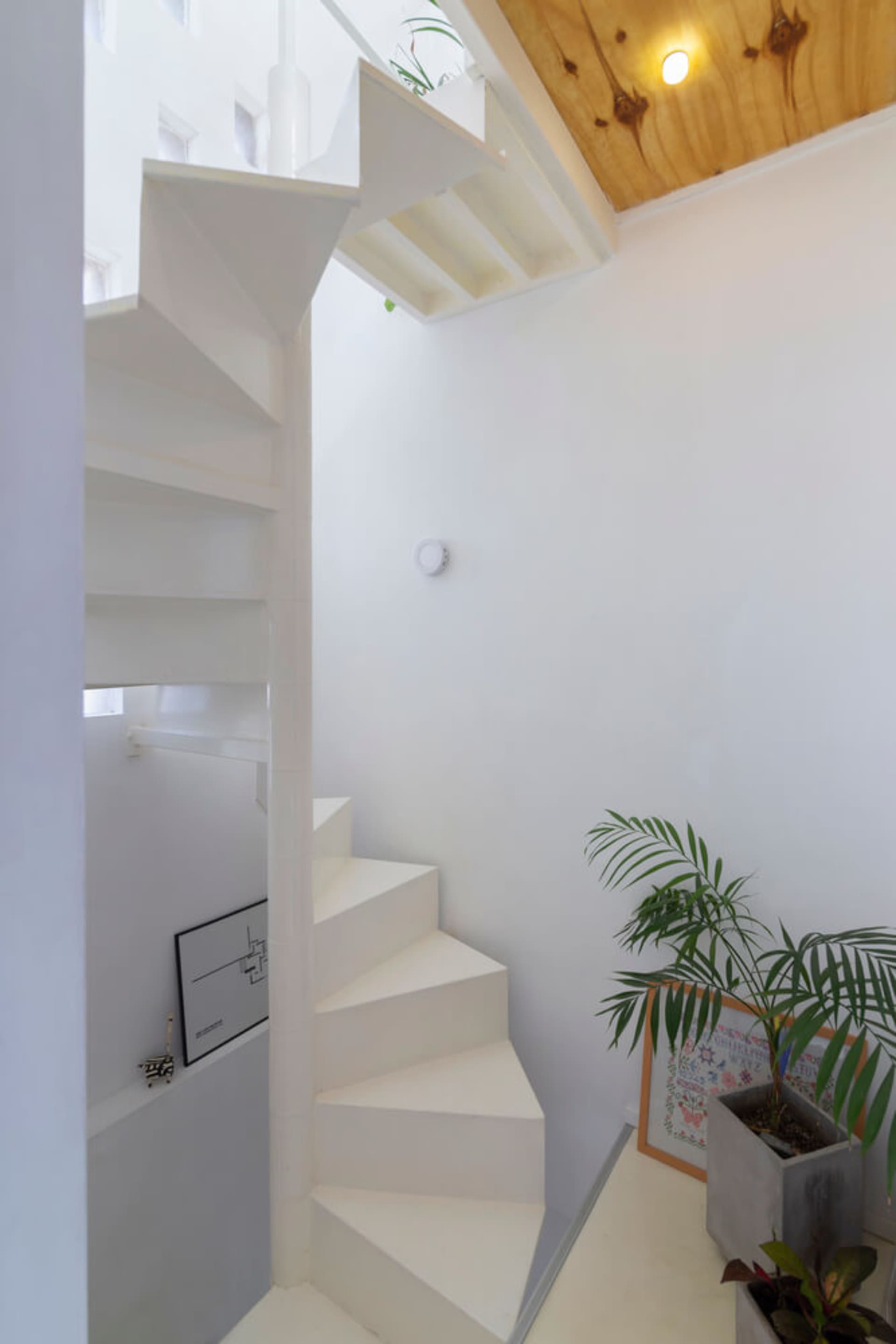 Modern interior design featuring a white staircase.