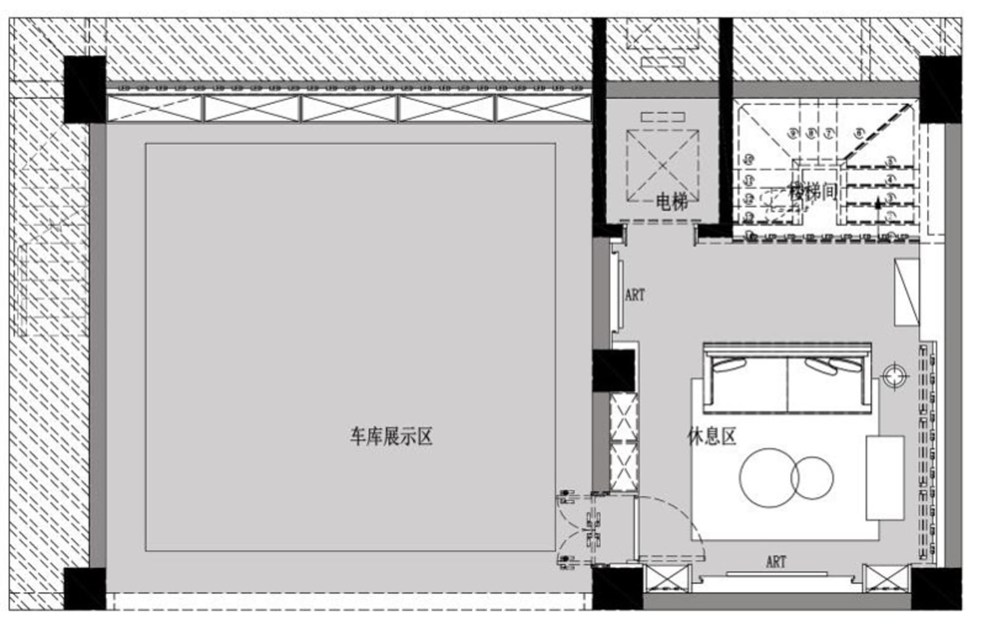 Floor plan of an industrial-style art exhibition center showcasing mixed materials and an elevator.
