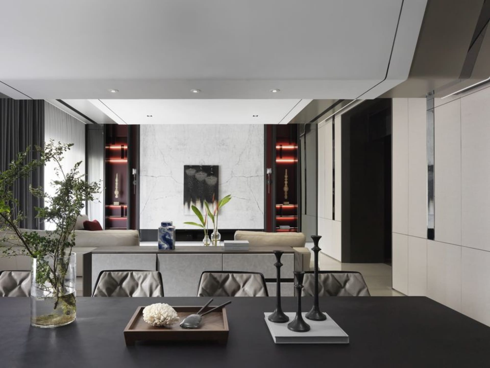 Modern living room featuring concrete and marble materials with contemporary design elements.