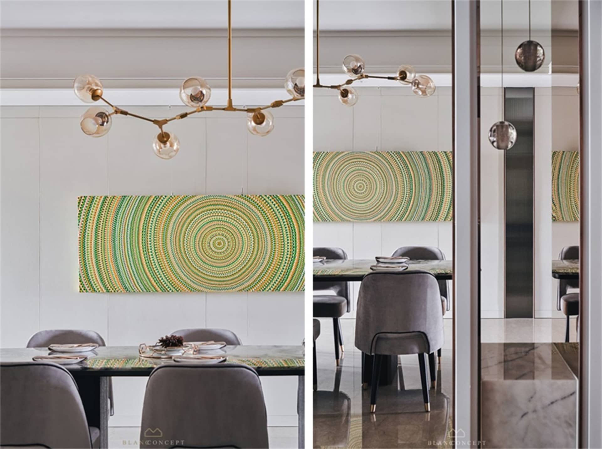 Modern dining room with a glass and metal chandelier and a circular green and yellow artwork.
