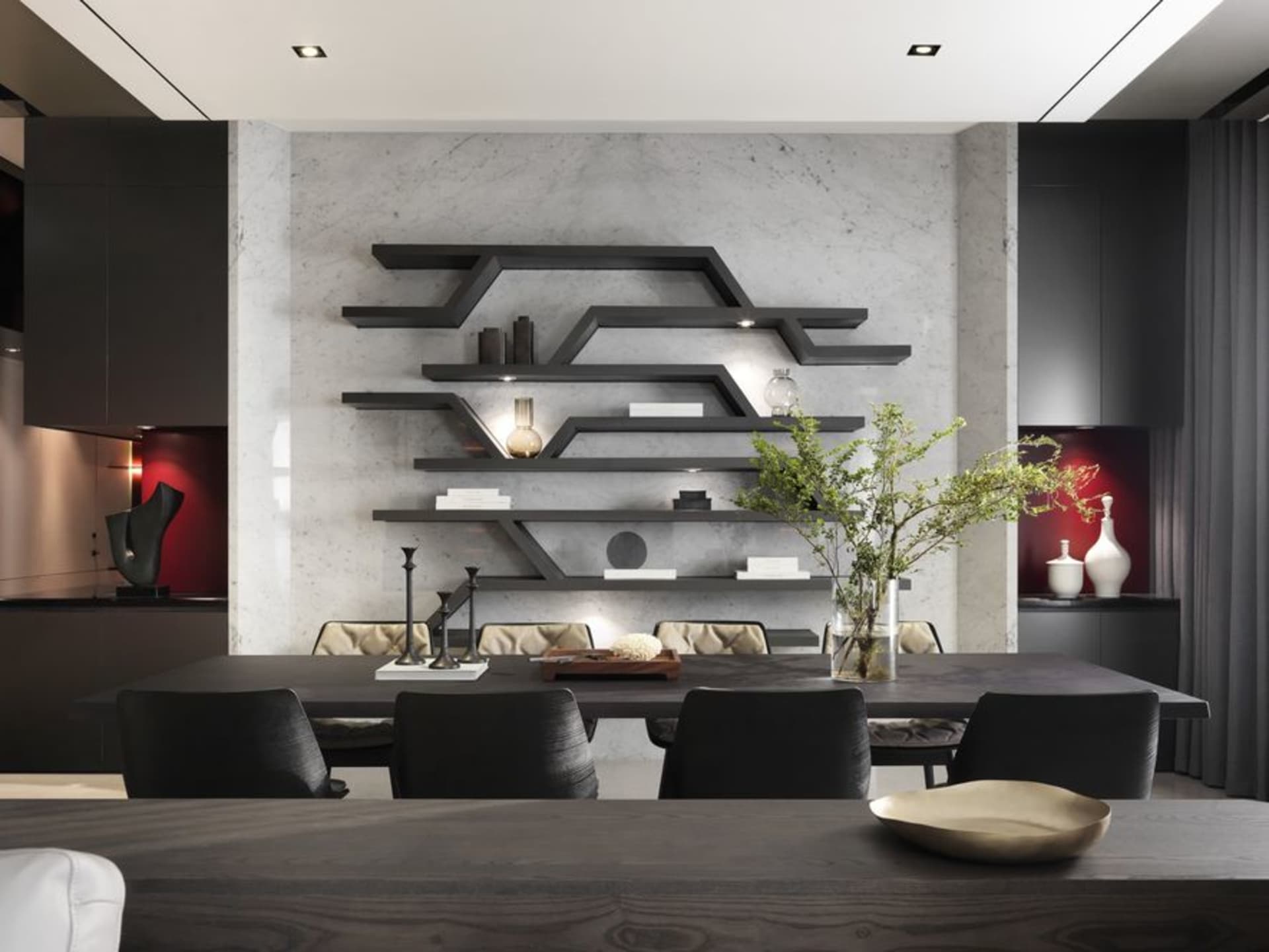 Modern living room with marble countertops, concrete walls, and black furniture