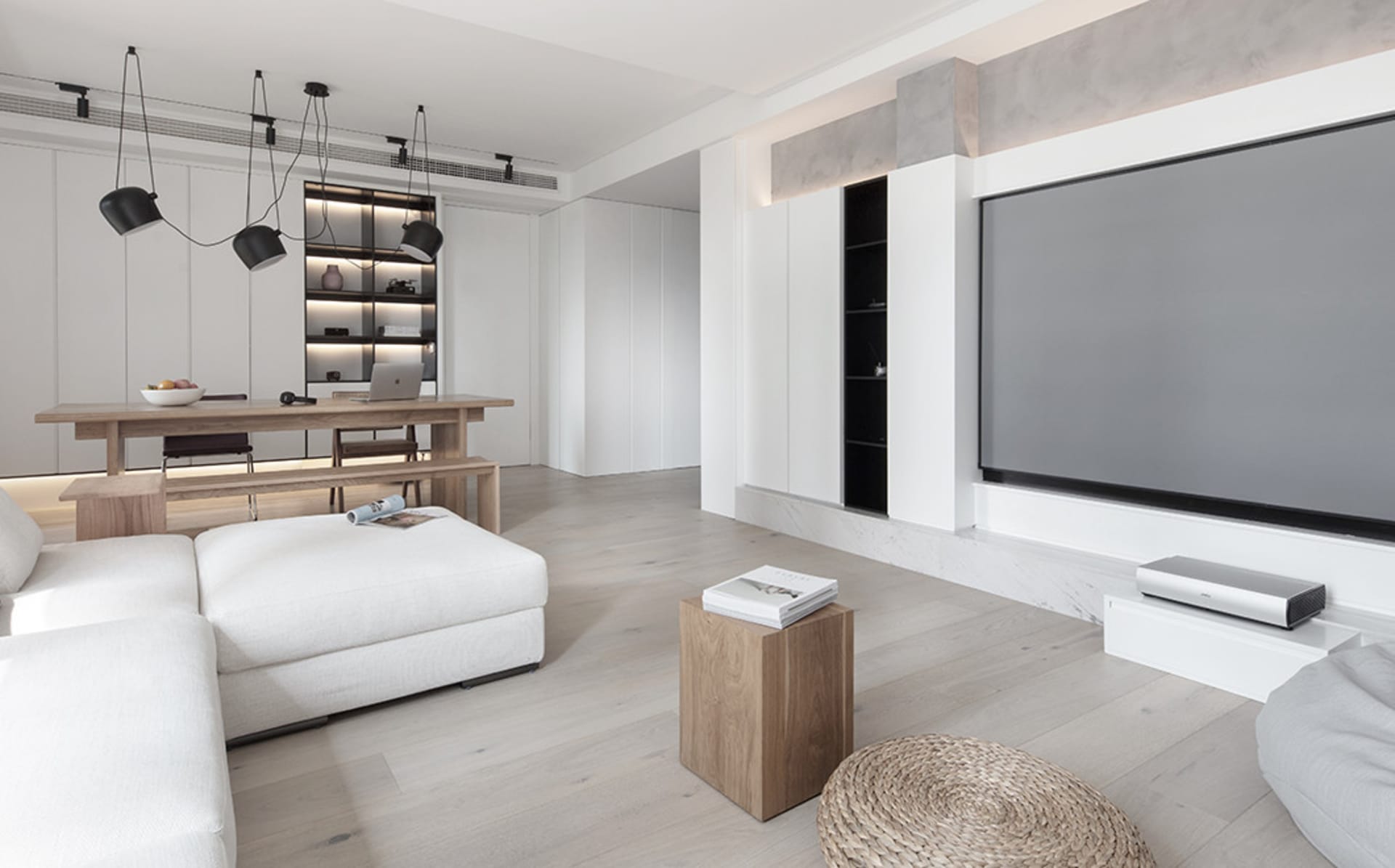 Modern minimalist living room featuring white cabinets, oak flooring, and wooden furniture.