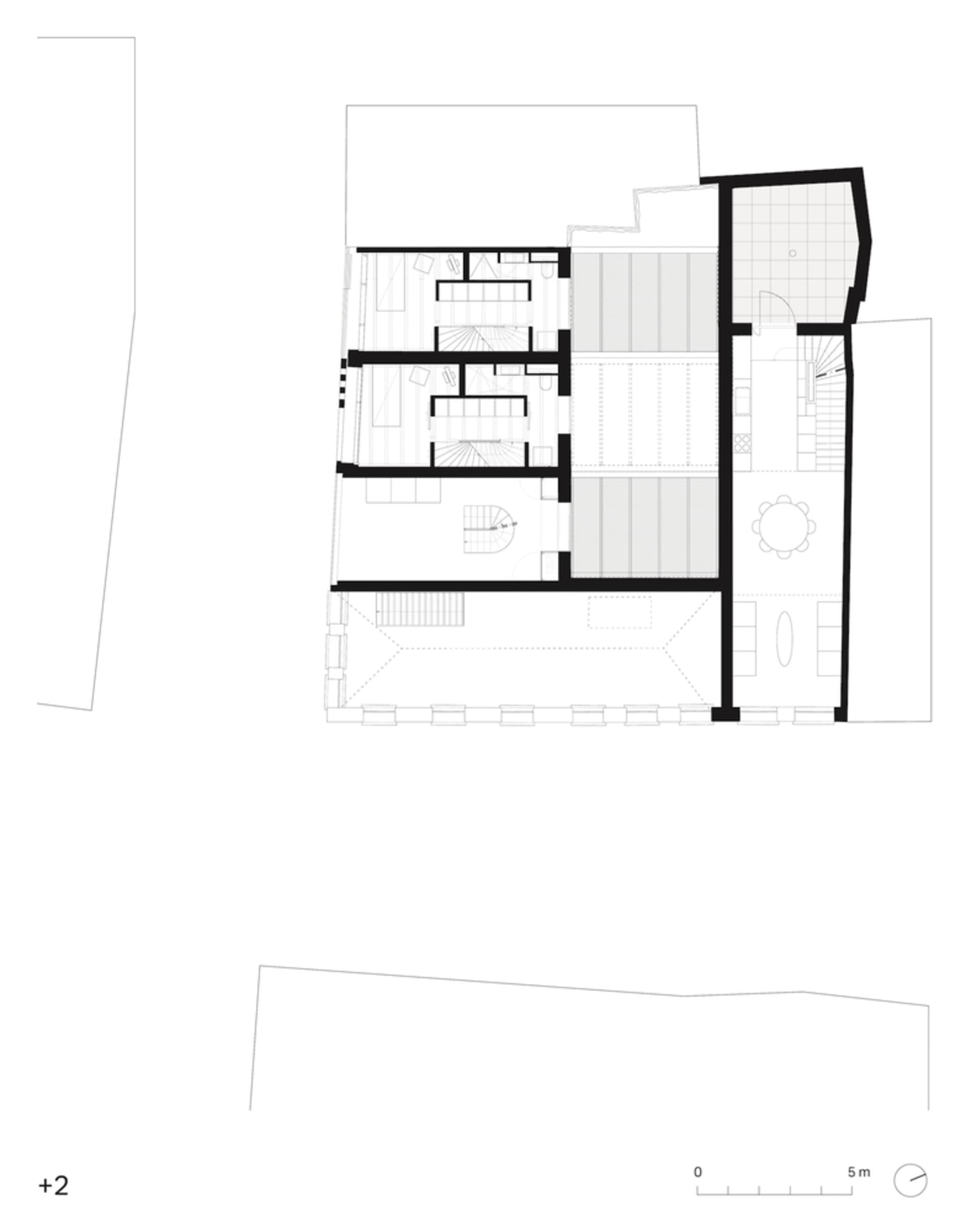 Floor plan of a modern residential building showing various rooms and sections, including living areas, bedrooms, and a kitch