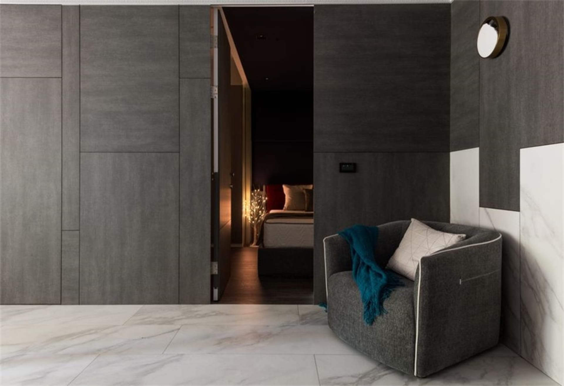 Modern living room featuring metallic cabinet and marble flooring