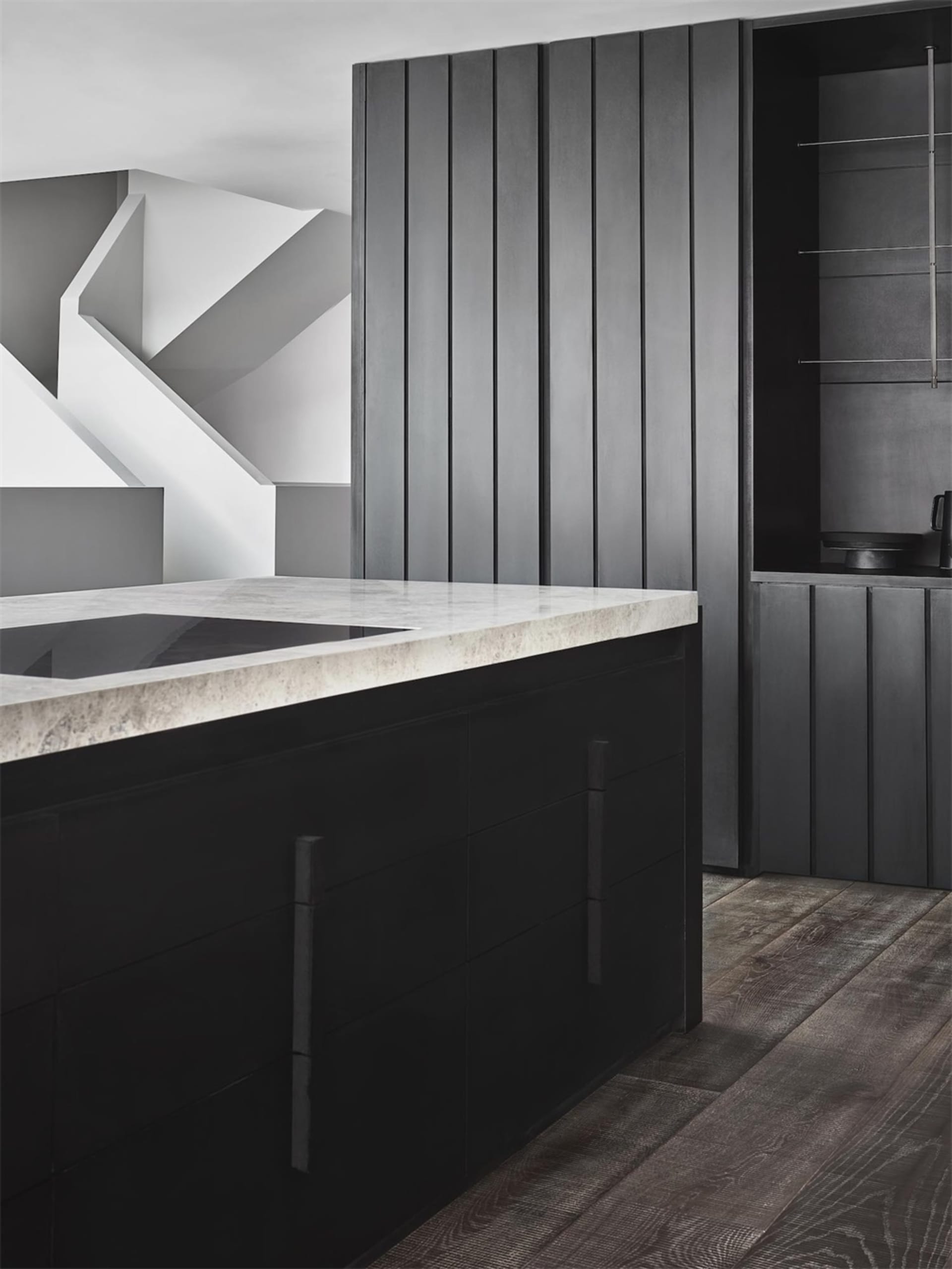 Modern kitchen interior designed with concrete cabinets, highlighting sleek, minimalist, and contemporary features.