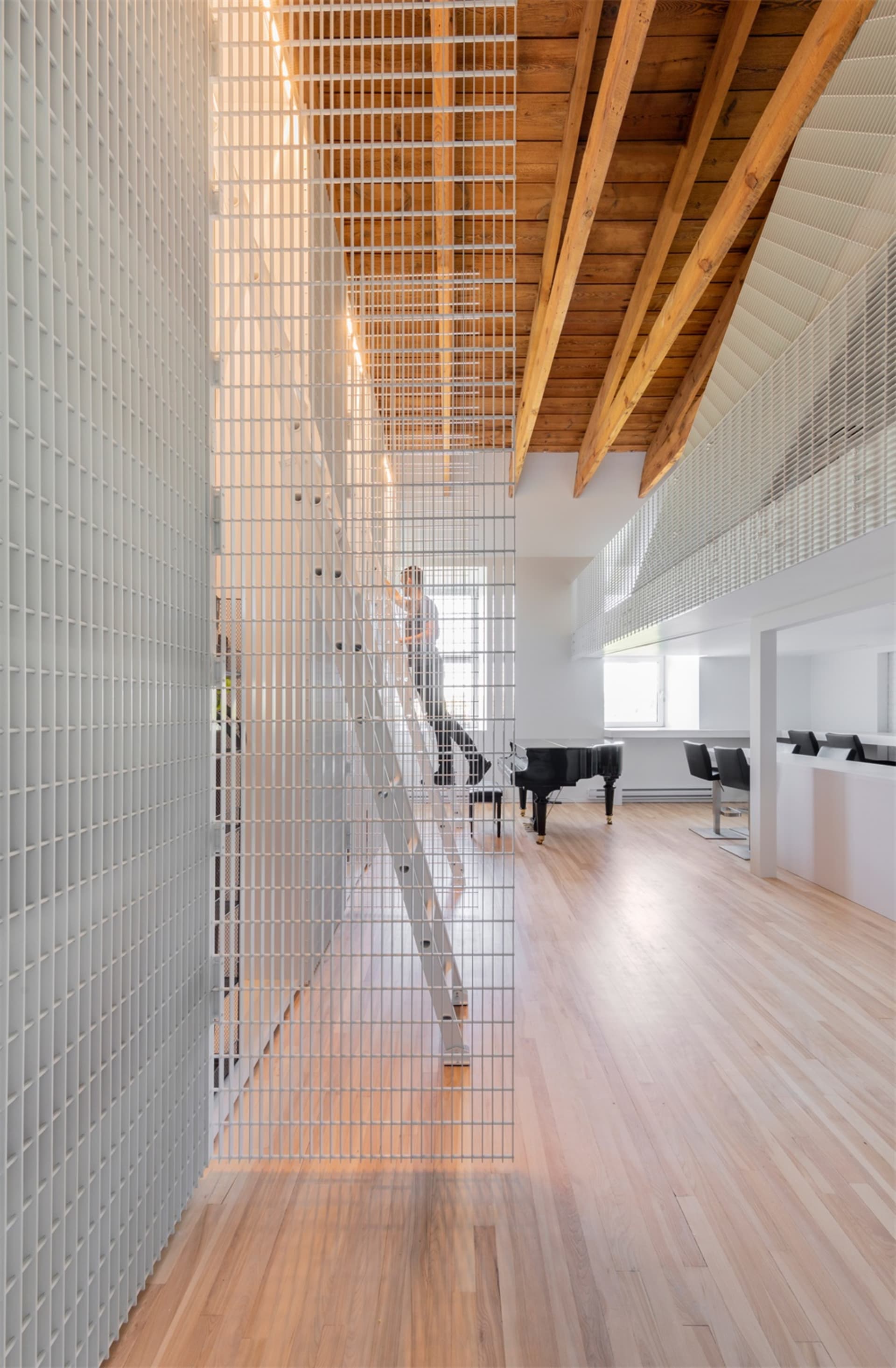 A modern interior design featuring metallic and wooden materials.