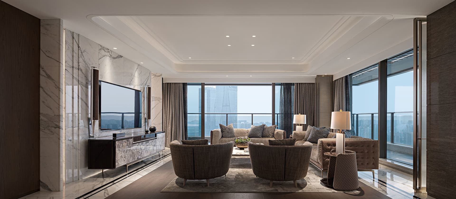Modern living room featuring marble walls and leather furniture