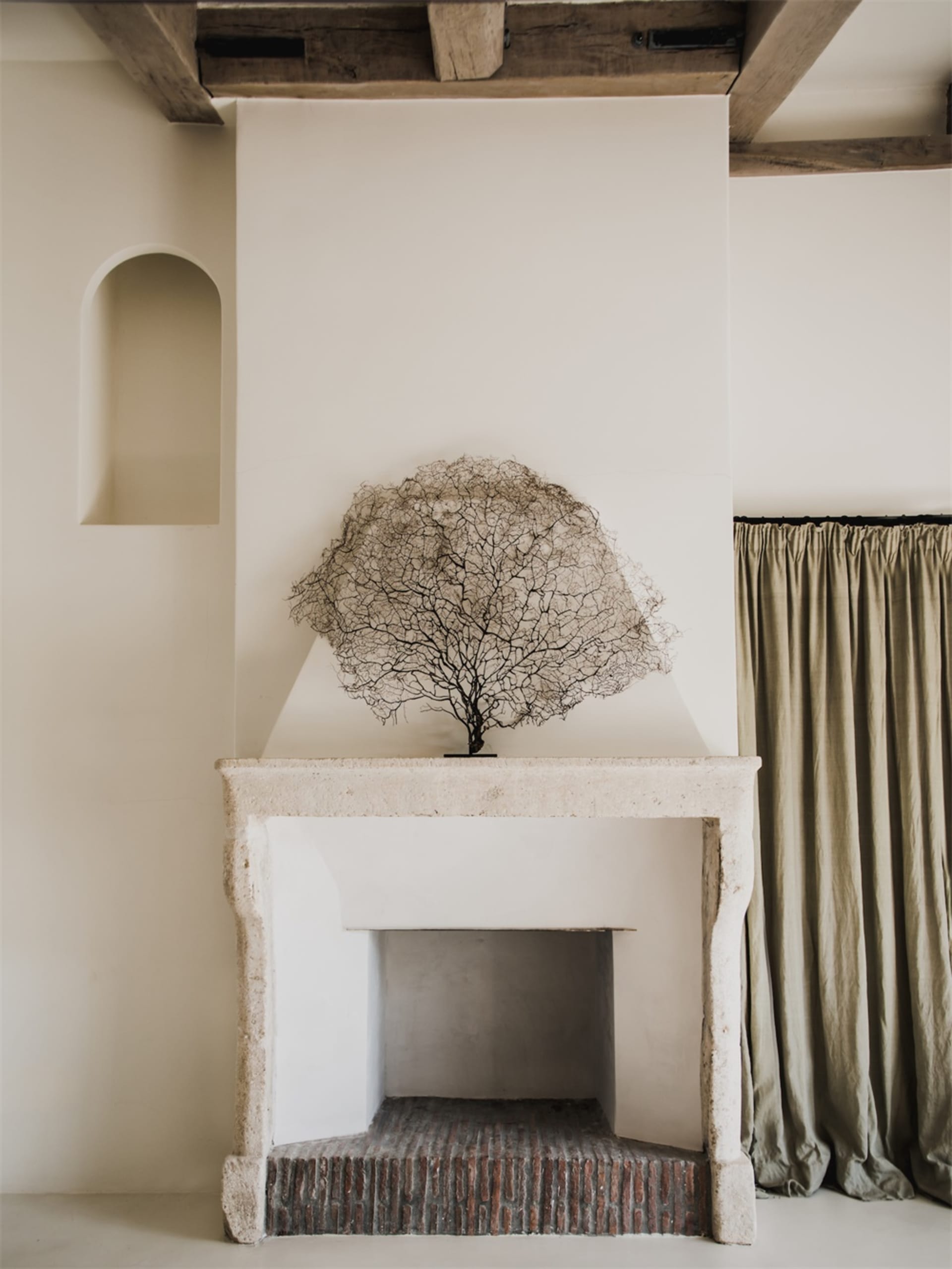 A modern interior with a stone fireplace.