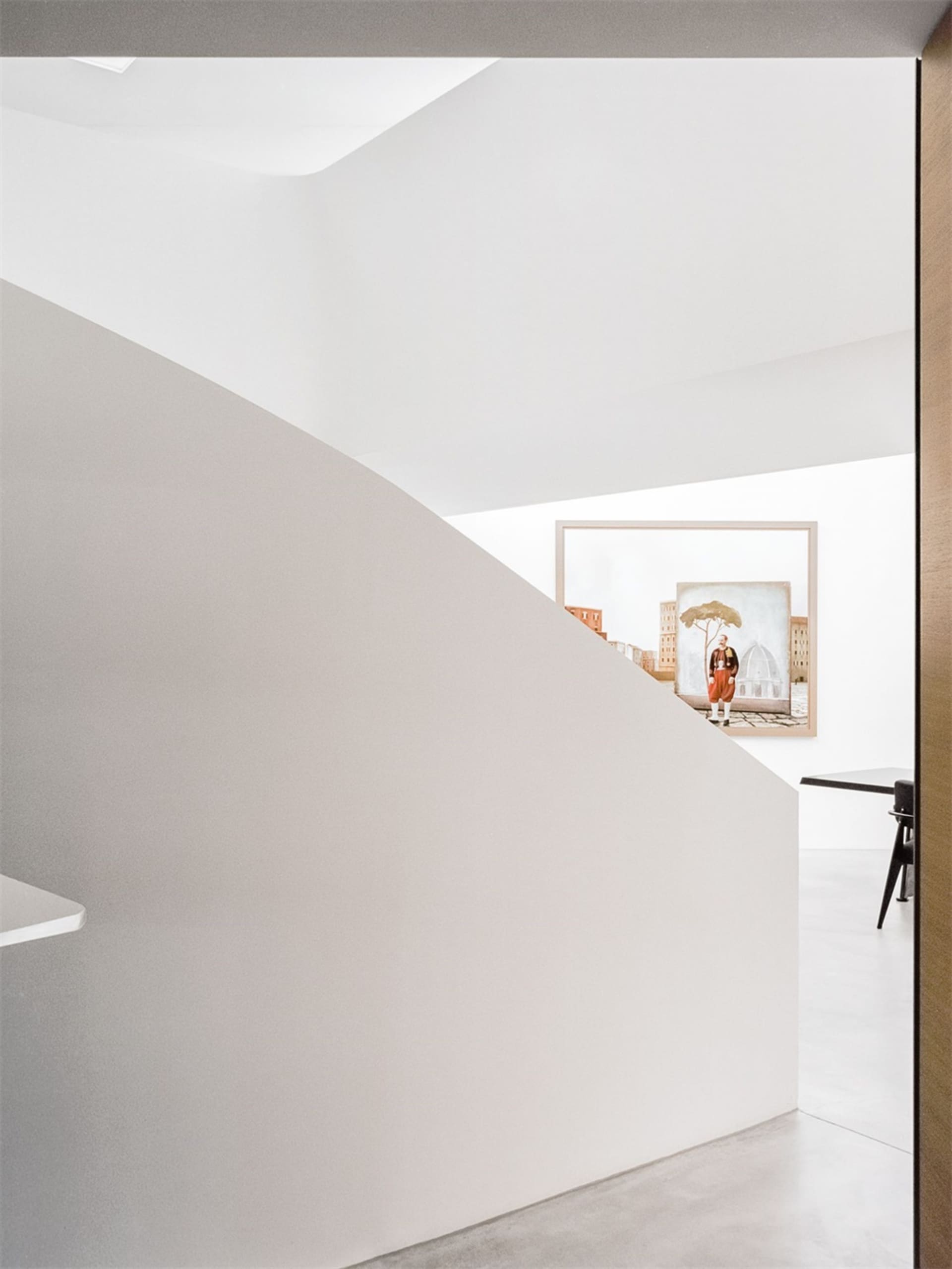 A modern interior space with concrete walls and minimalist design.