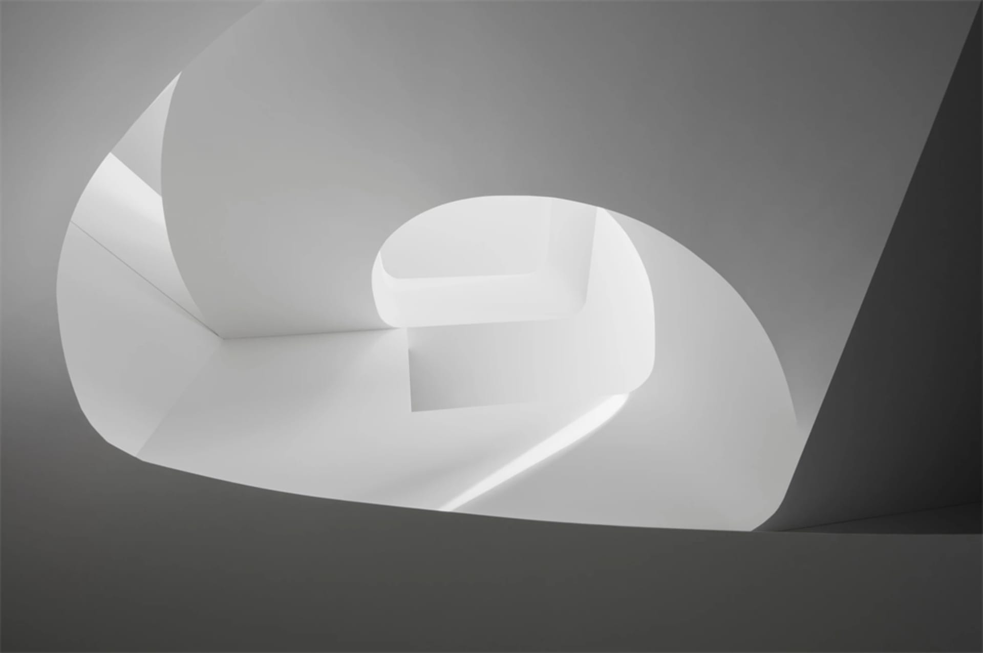 A modern white interior with concrete elements.