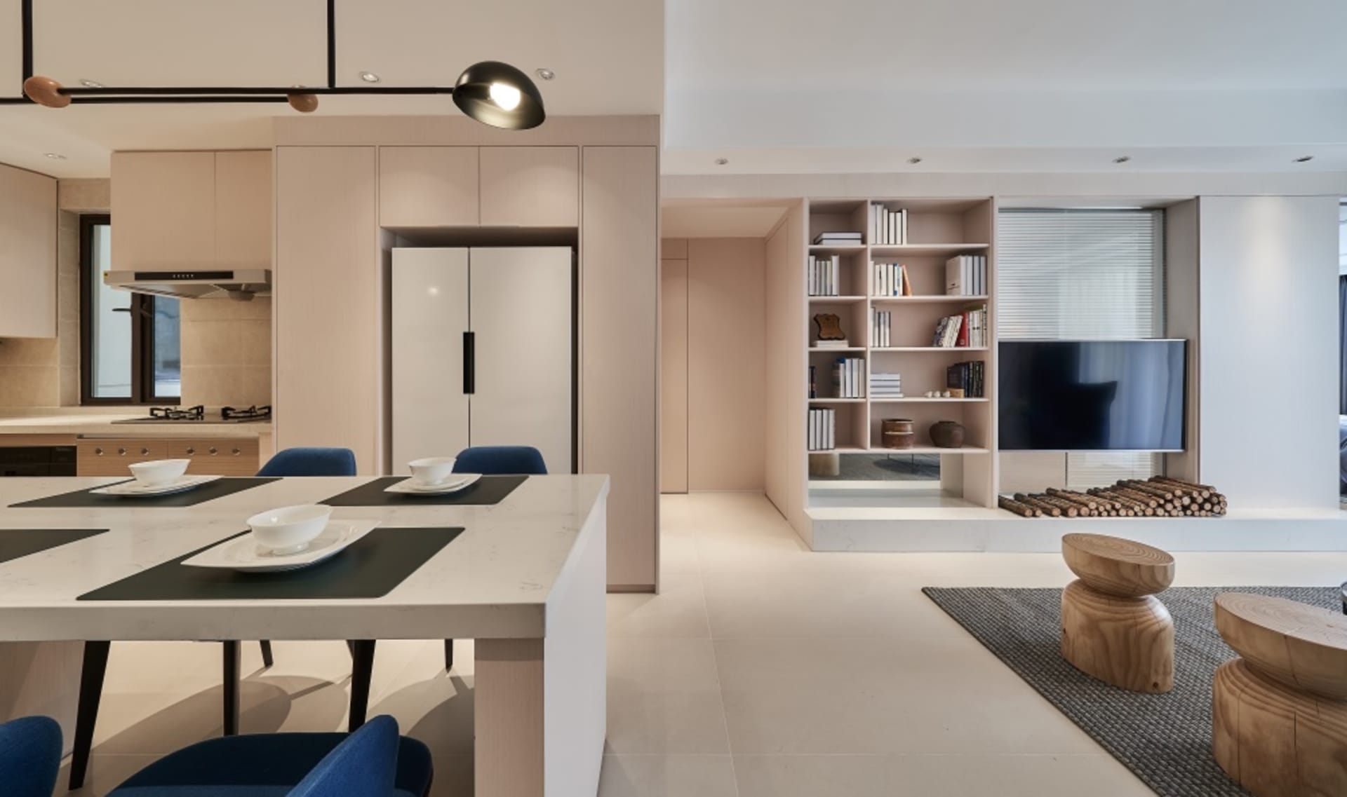 Modern minimalist living room with white walls, wooden floors, and a combination of soft and hard materials.