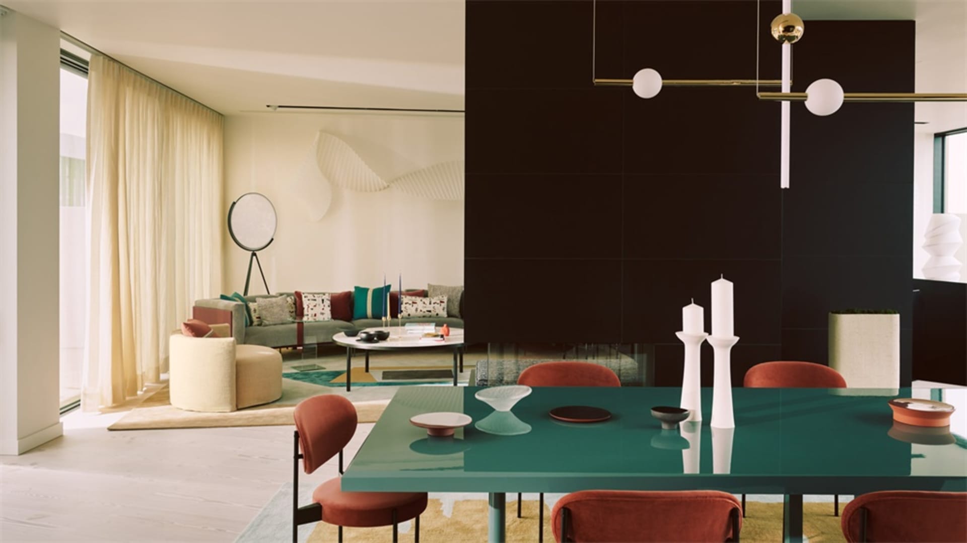Modern living and dining room with contemporary furniture and design elements.