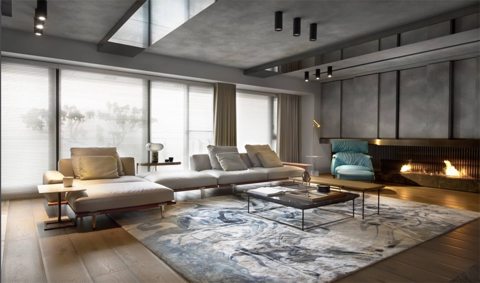 Modern industrial living room with concrete walls, large windows, and a cozy seating area