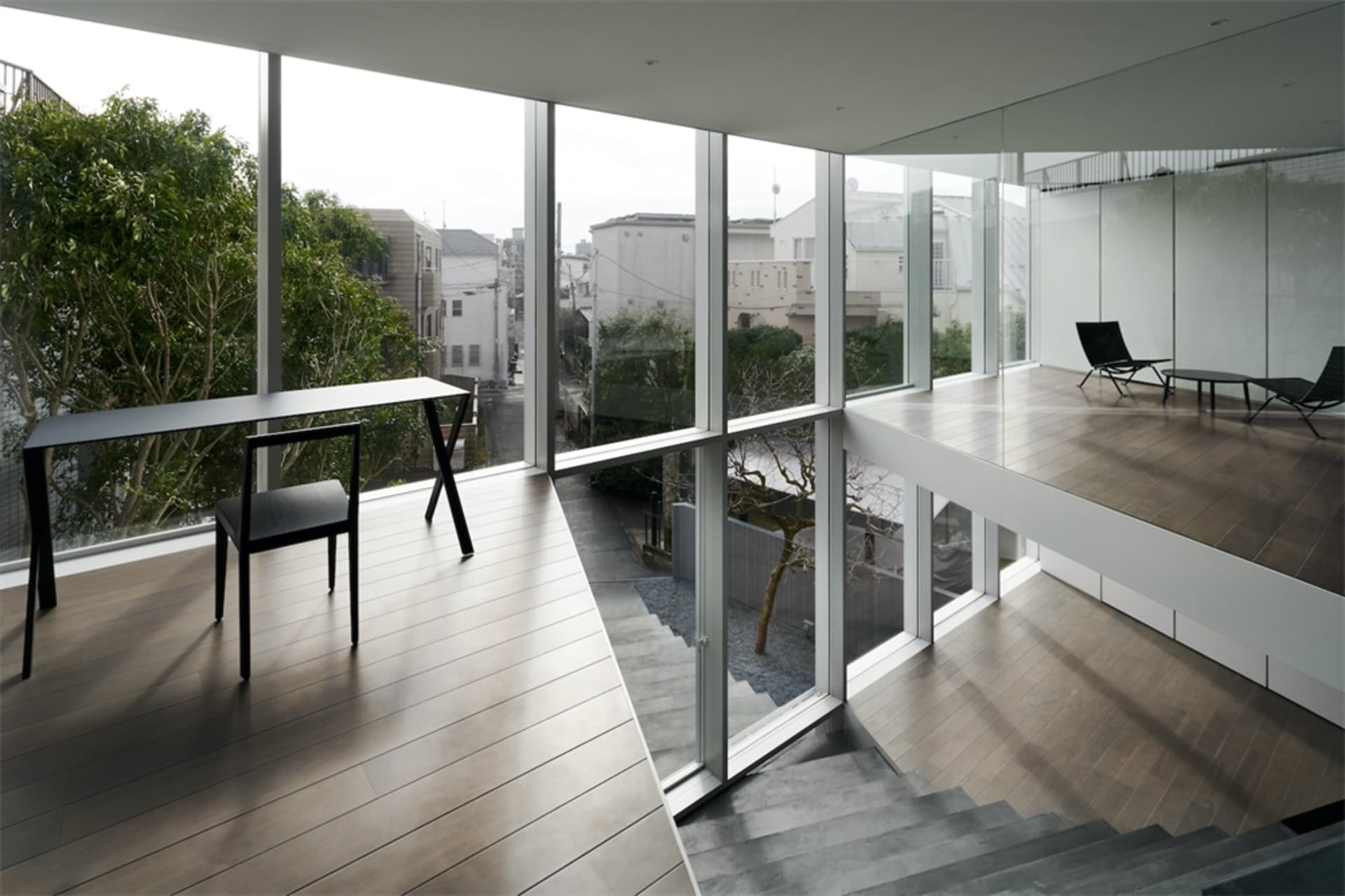 Modern residential interior adorned with wood, glass, and metal elements.