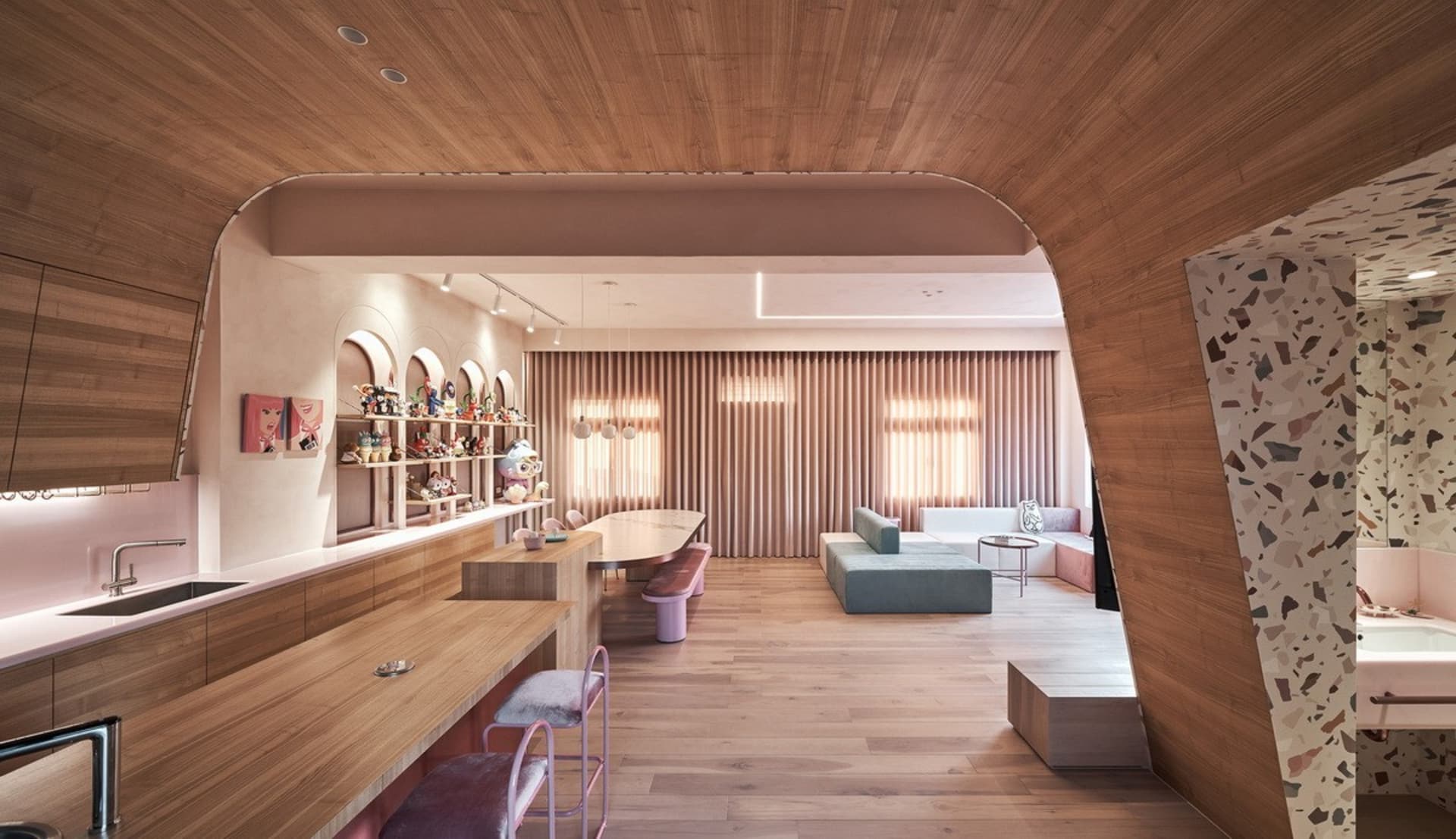 A modern living room featuring wood flooring and wooden furniture.