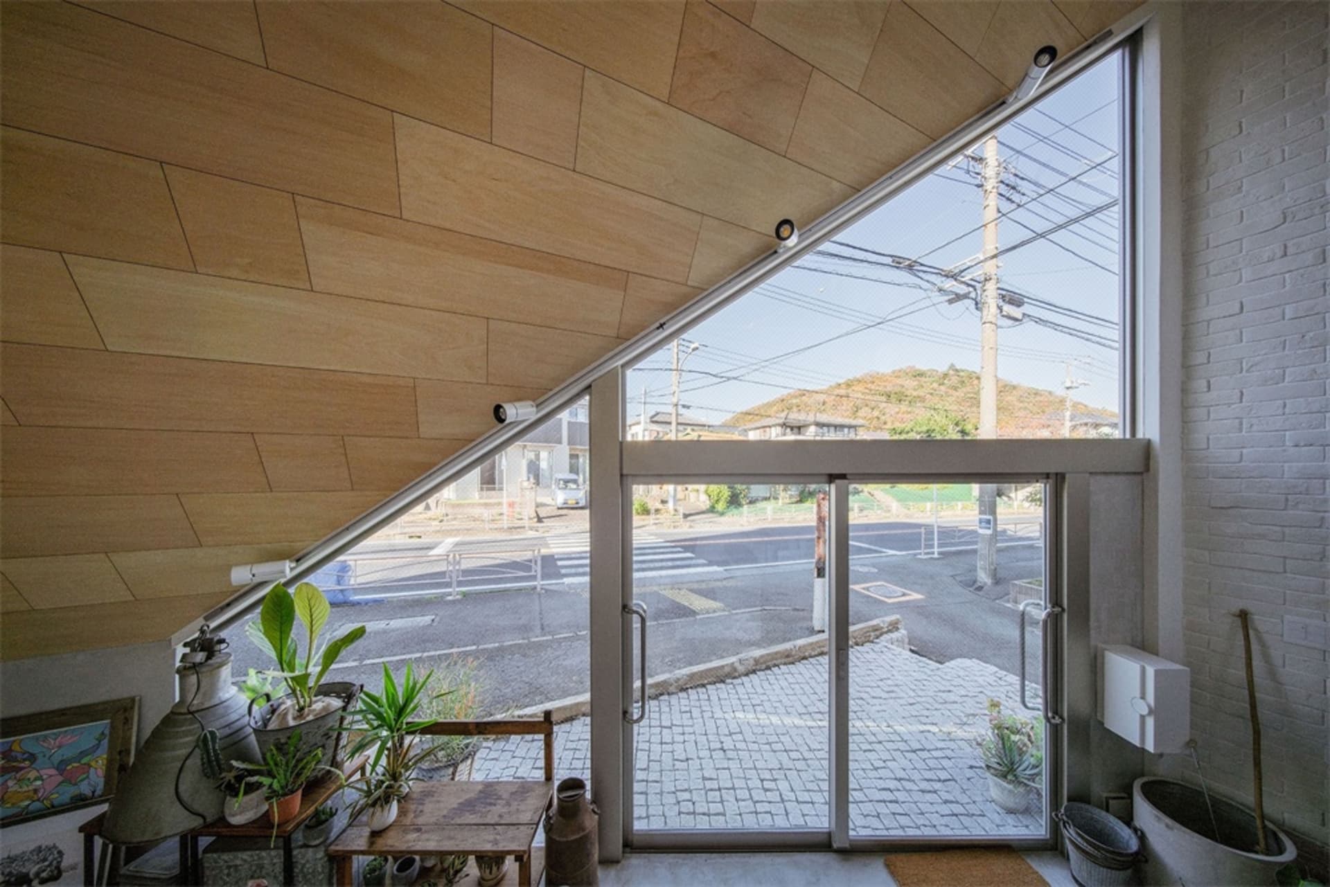 Modern home with wooden walls and glass door