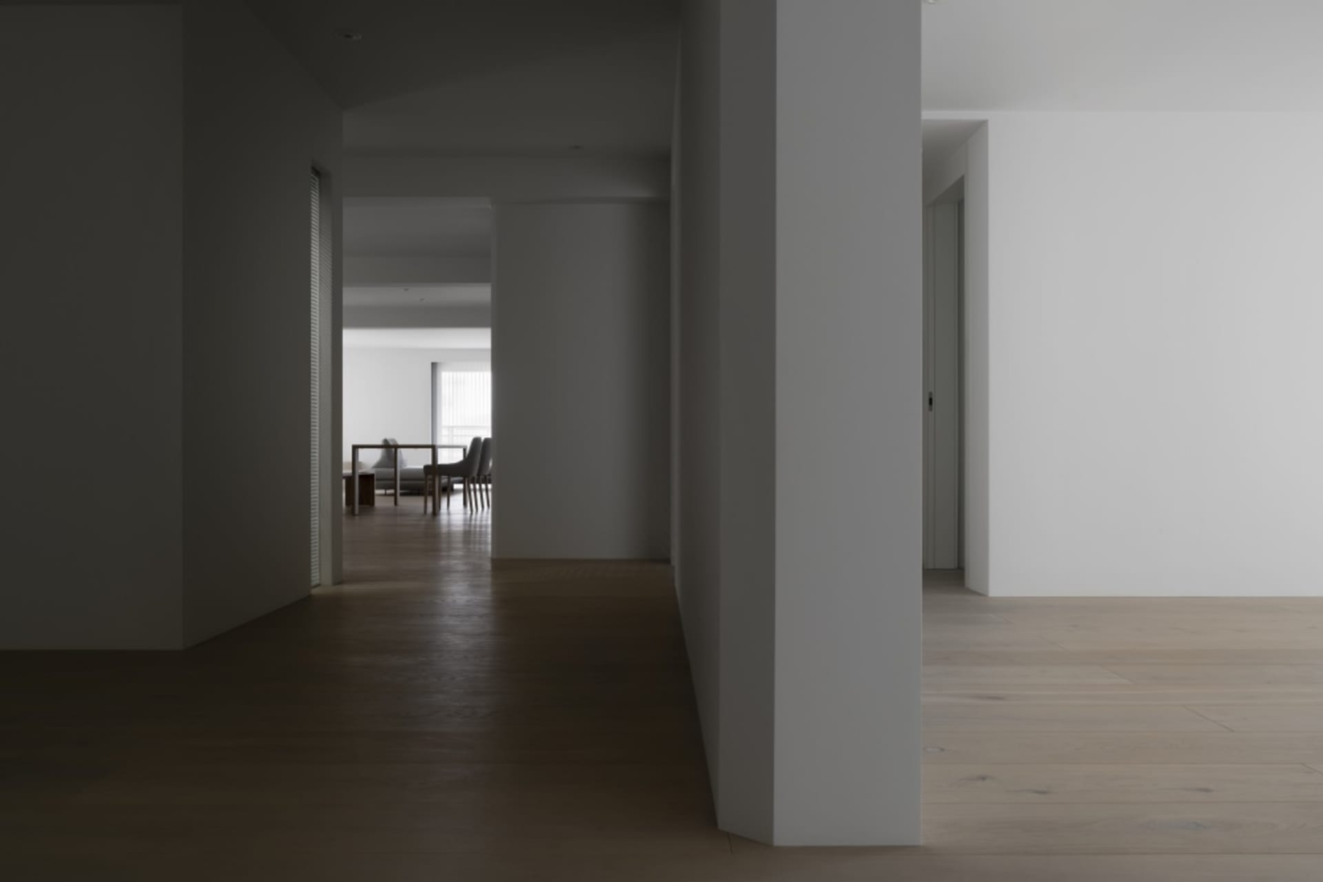 An interior design showcasing modern elements with light wood flooring.