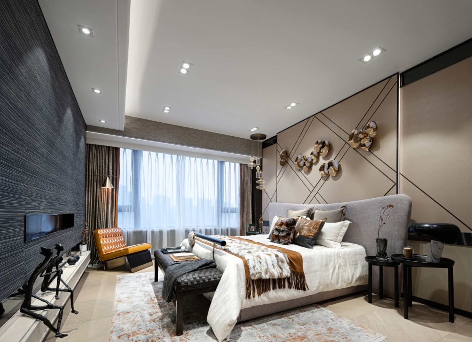 Modern bedroom with textured wall coverings, a gray upholstered bed, and a lounge chair in warm tones.