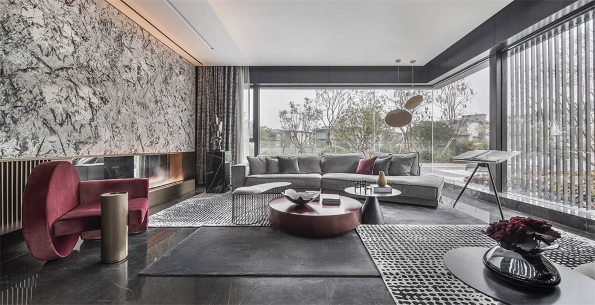 Modern living room featuring metallic, glass, and marble design elements