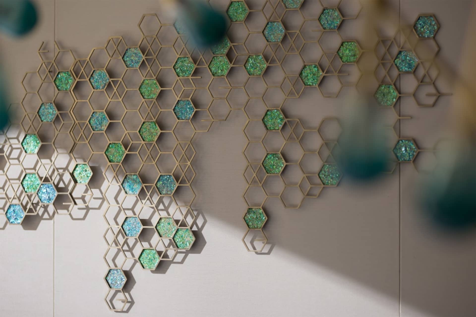 Modern interior design featuring a wall art hexagon pattern with a metal hexagonal grid and foam insulation.