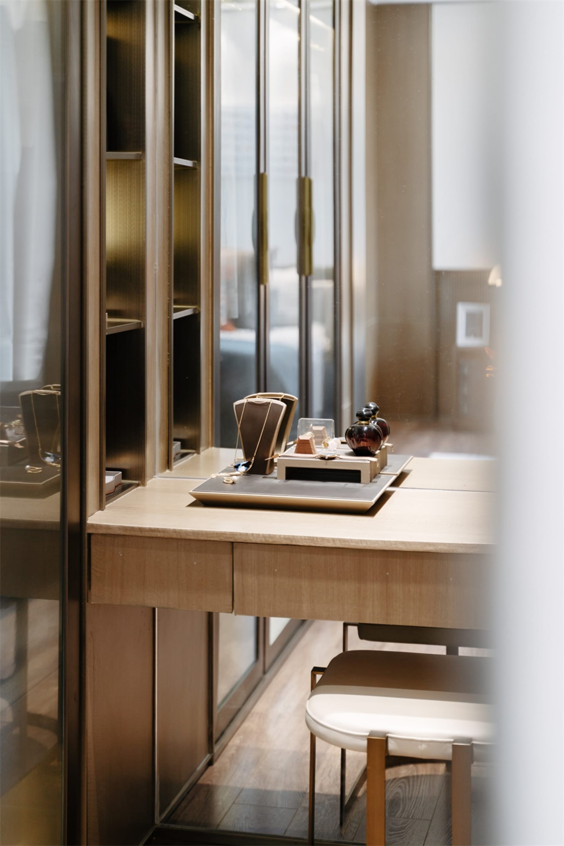 Modern vanity table with a wood finish, showcasing sleek design with minimalistic elements.