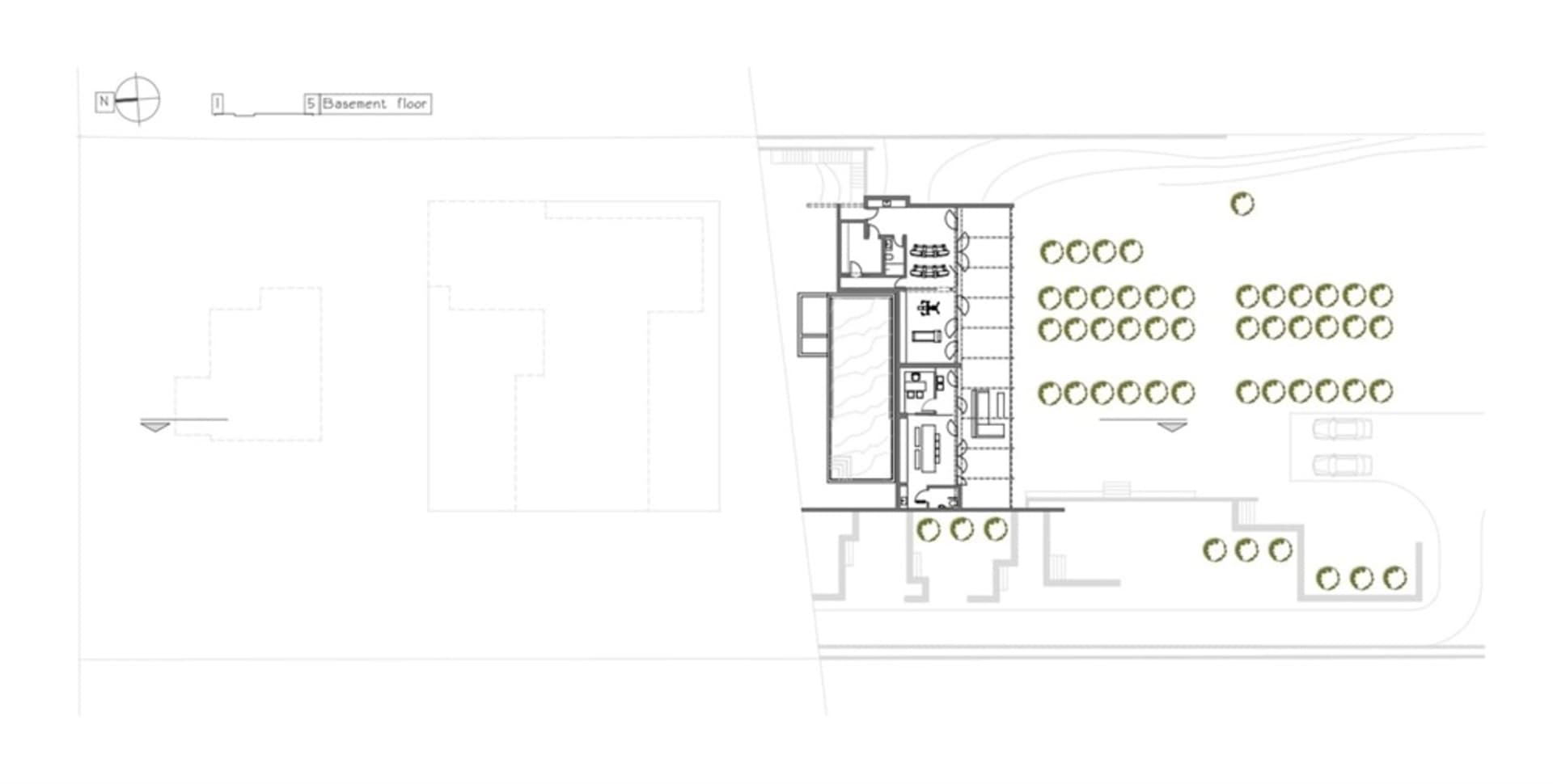 A building section plan showing the layout of different sections of a building including rooms, corridors, and outdoor spaces