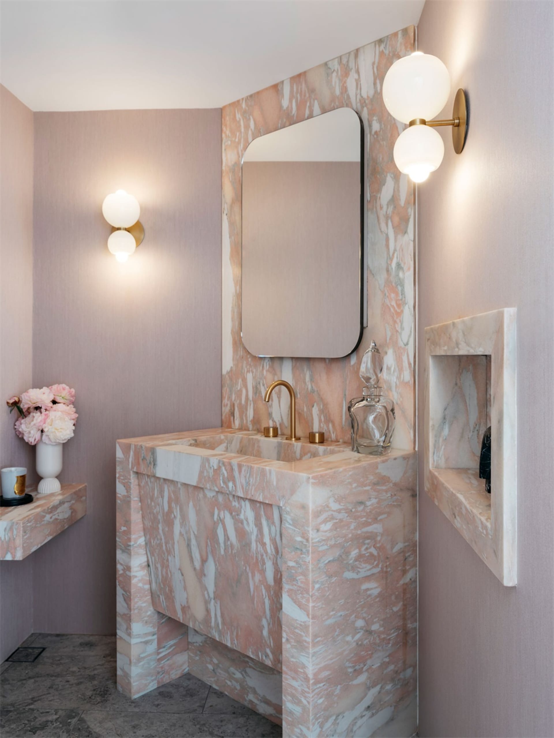 Modern bathroom featuring marble finishes and minimalist design.