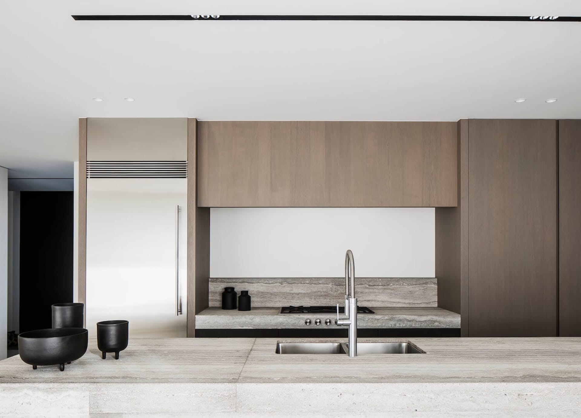 Modern kitchen interior featuring stone material and green accents