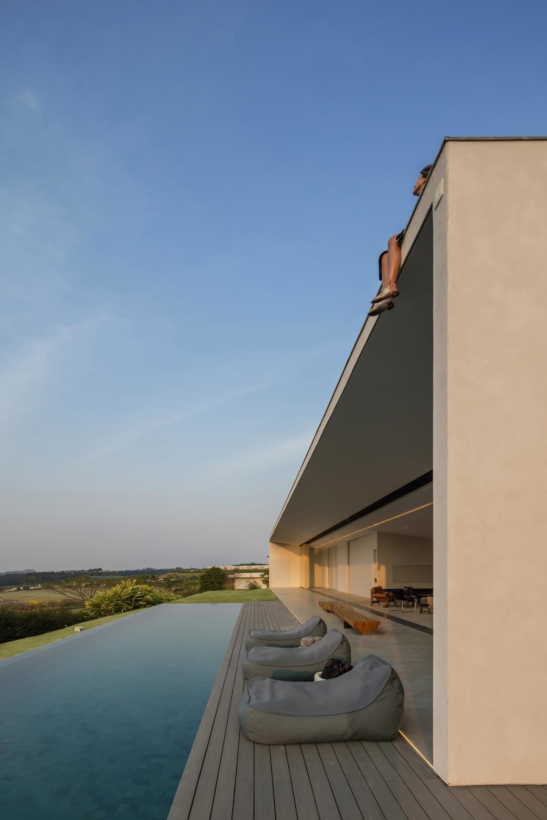 Modern house featuring concrete and glass with a scenic skyline view.