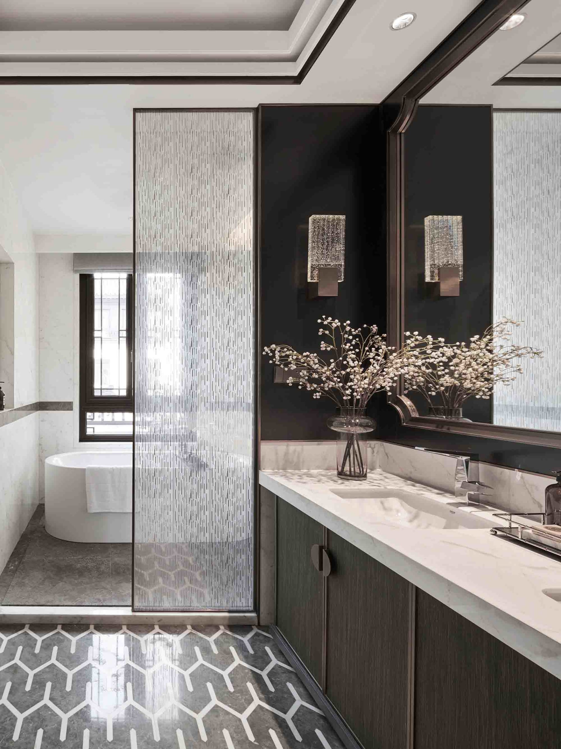 Modern bathroom with glass tiles and wooden vanity