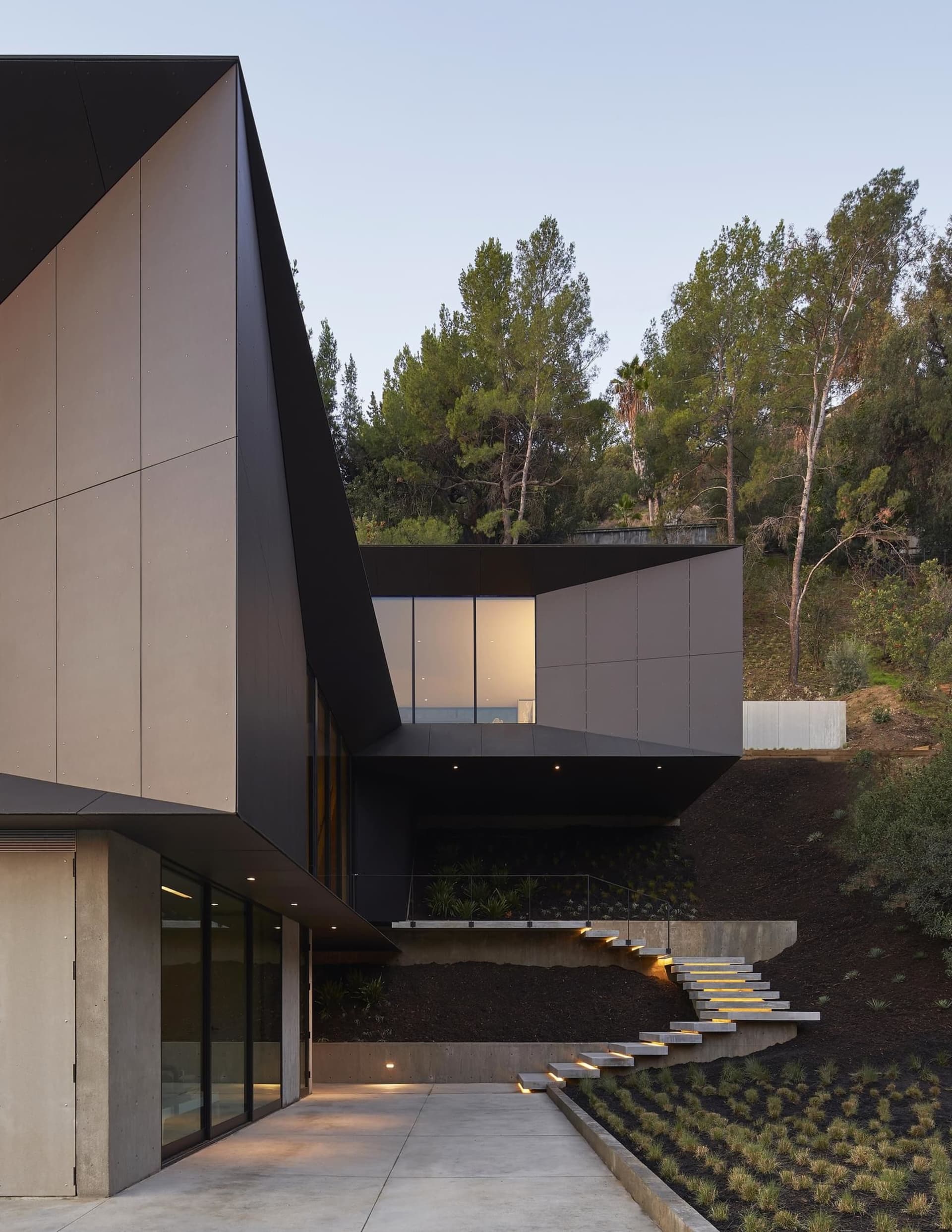 Modern house exterior featuring metal and glass construction.