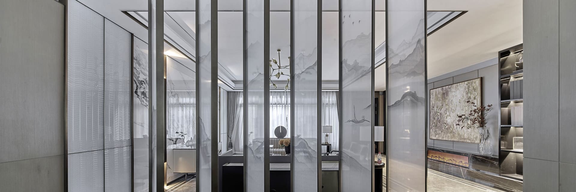 Modern living room with glass walls and minimalist decor.