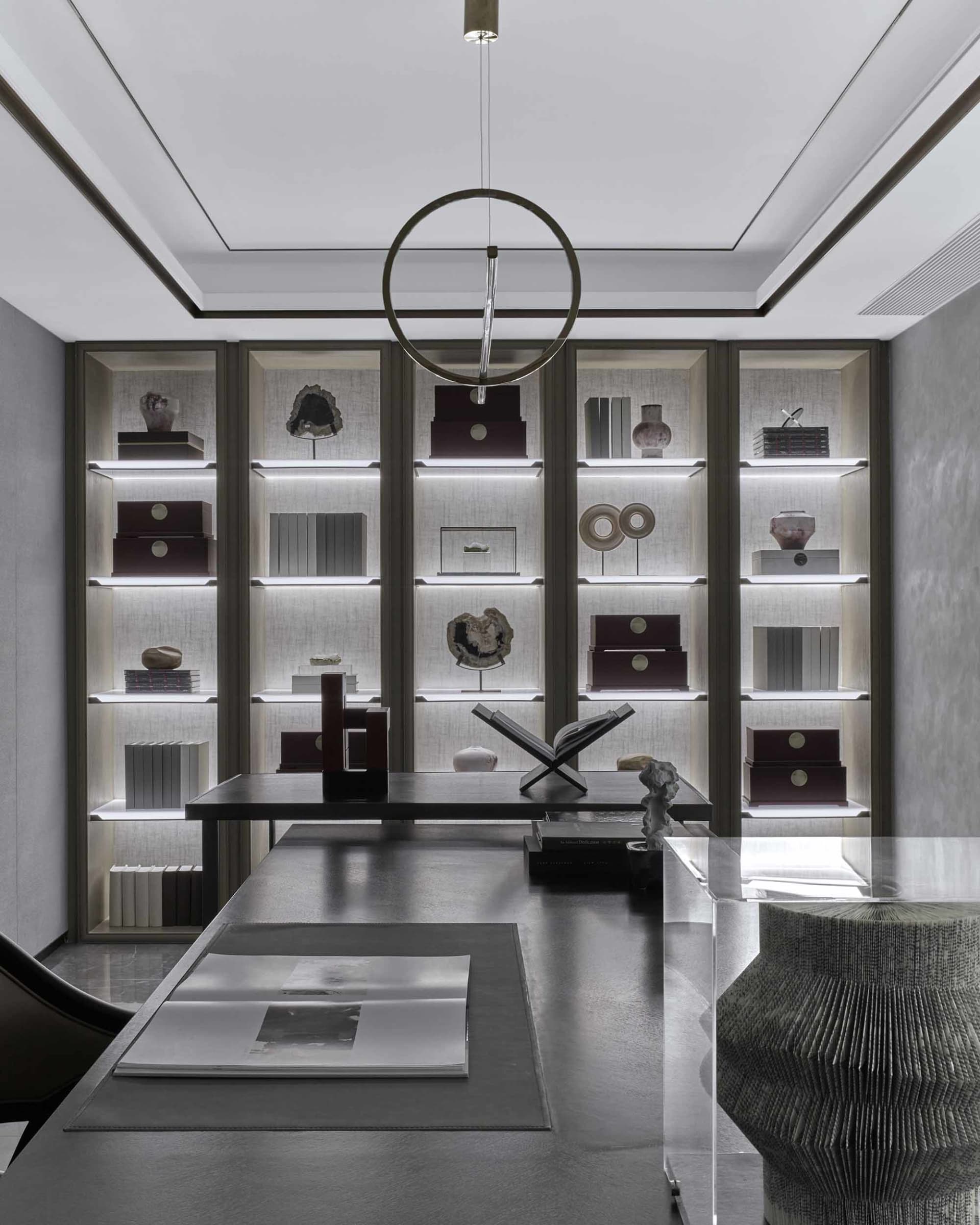 Modern office space featuring glass, metallic, and wood materials.